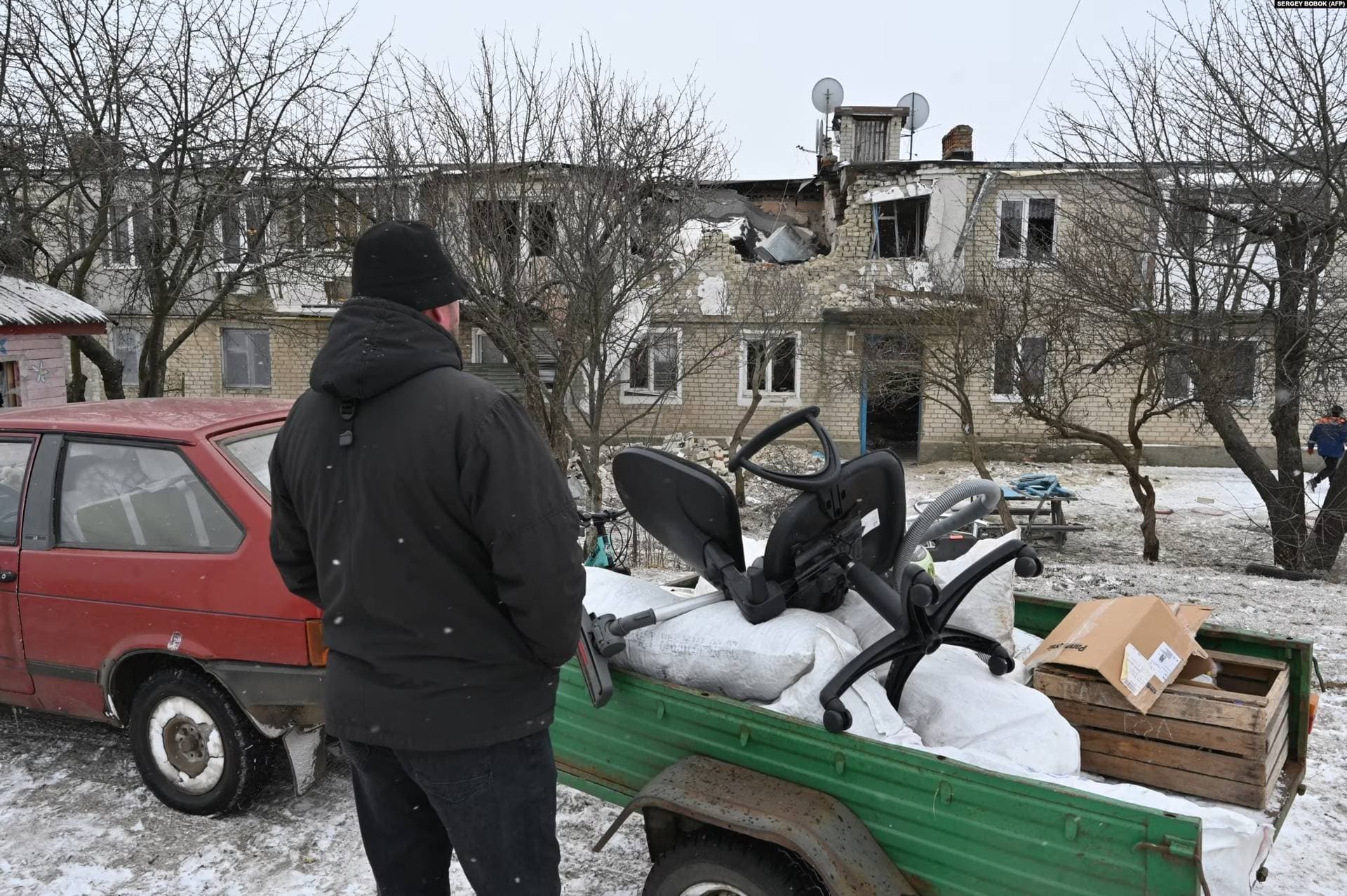 A resident of Kupyansk collects possessions from his home on February 13 after it was destroyed by Russian shelling