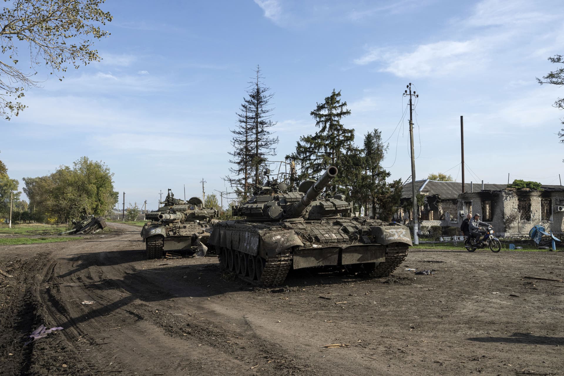 Abandoned Russian tanks stand on the road in recently liberated town Kupiansk