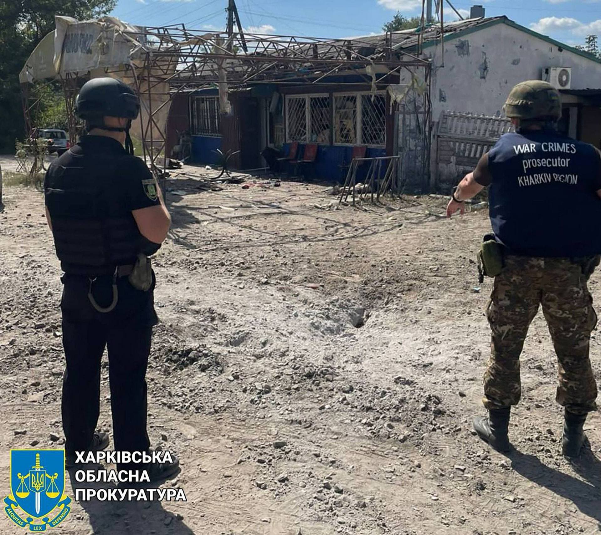War crime prosecutors at the cafe in the village of Podoly near Kupiansk