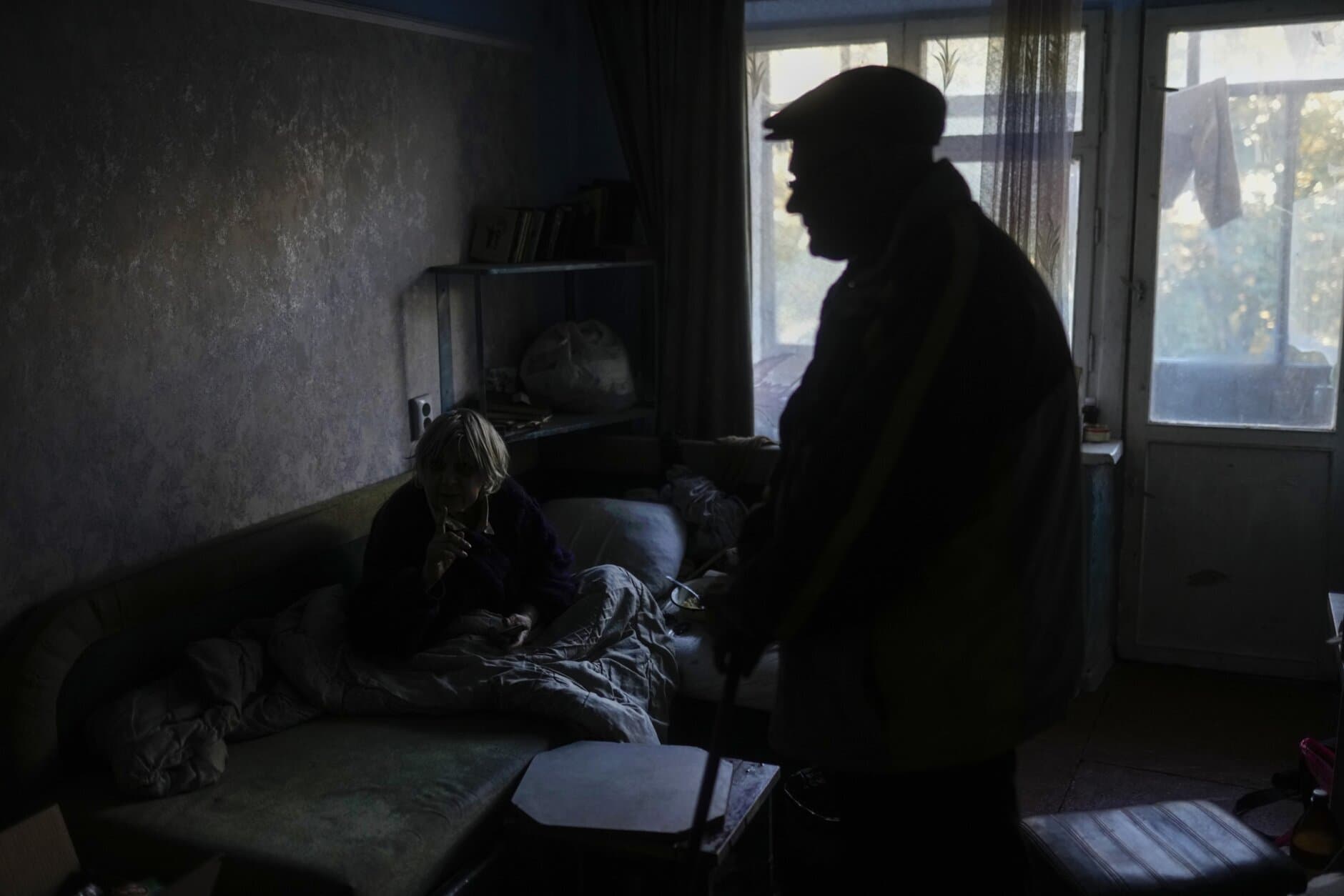 Zoya Sevrukova and her son Anton talk at the living room of their apartment in Kivsharivka