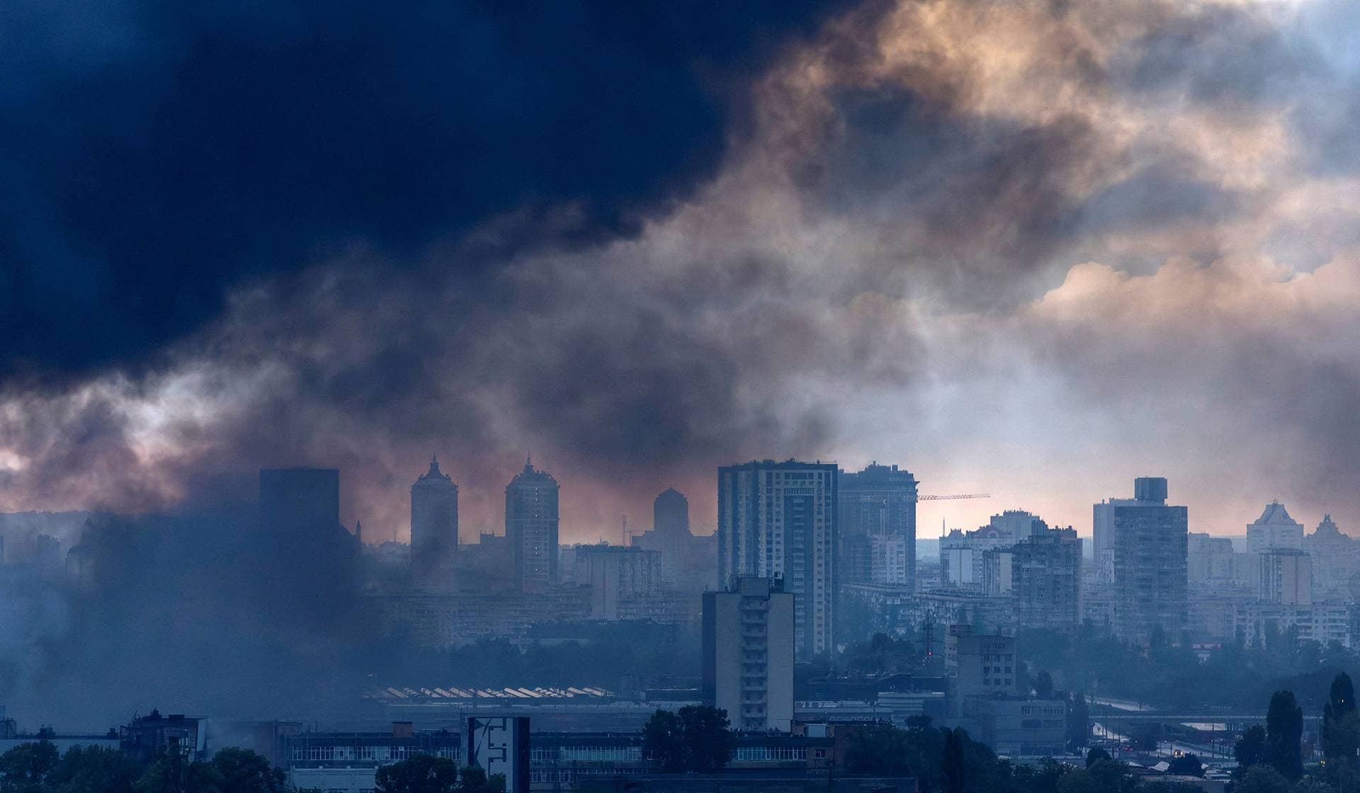 Smoke rises over the city after a night of Russian missile and drone strikes in Kyiv