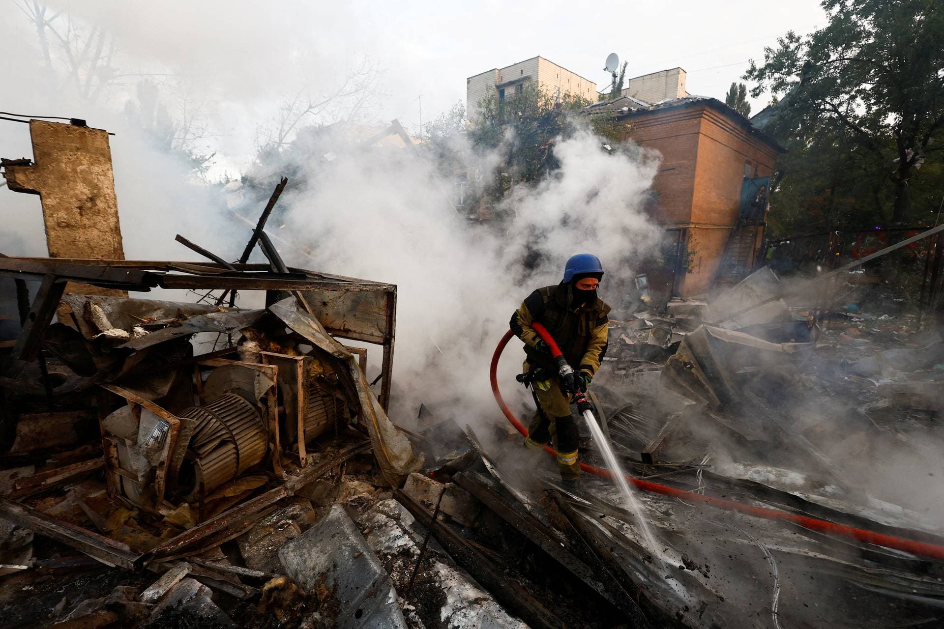 A firefighter at the scene of a Russian missile strike in Kyiv