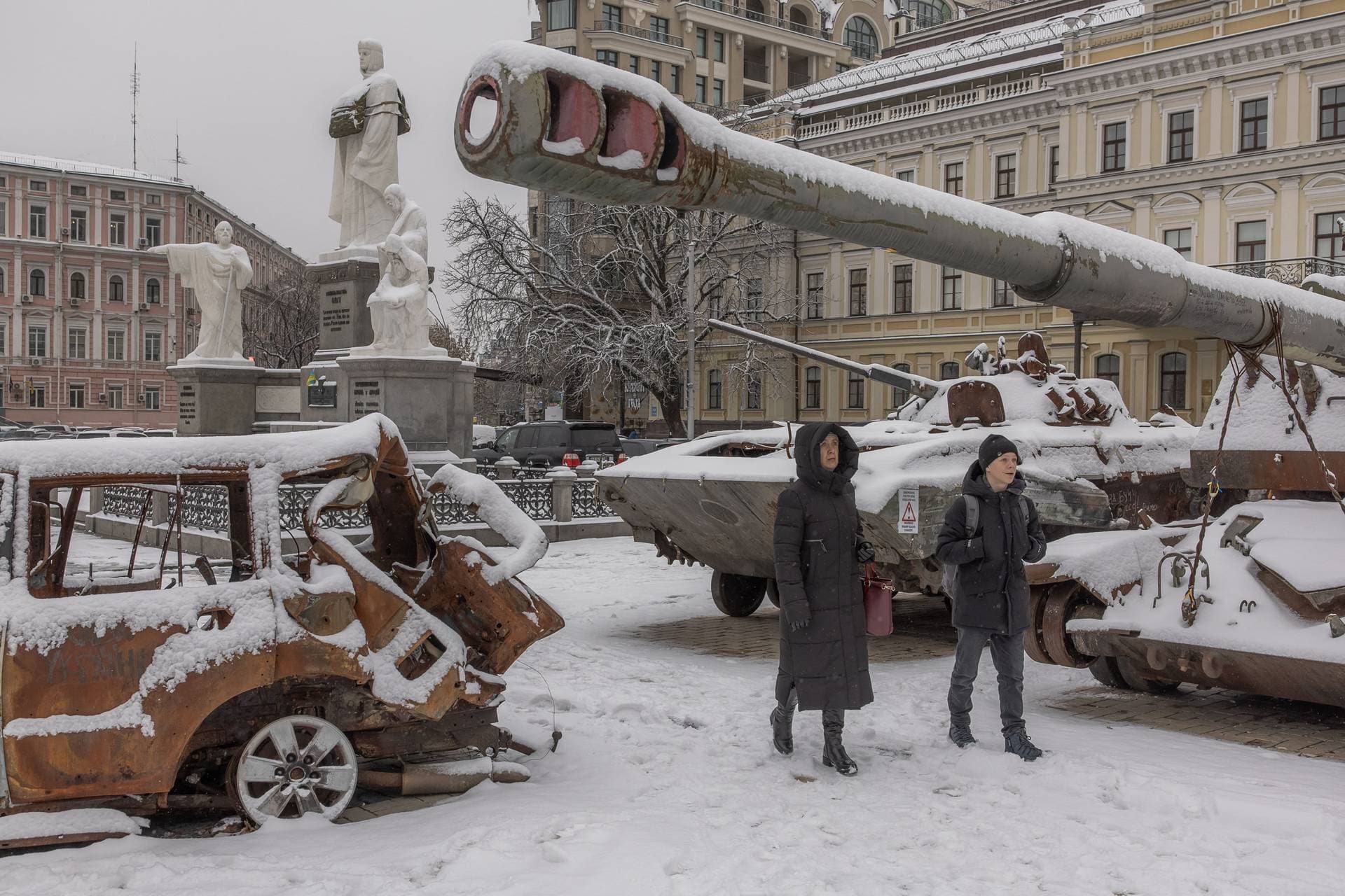 Pedestrians walks past destroyed Russian military vehicles in front of Saint Michael’s Golden-Domed Monastery in Kyiv