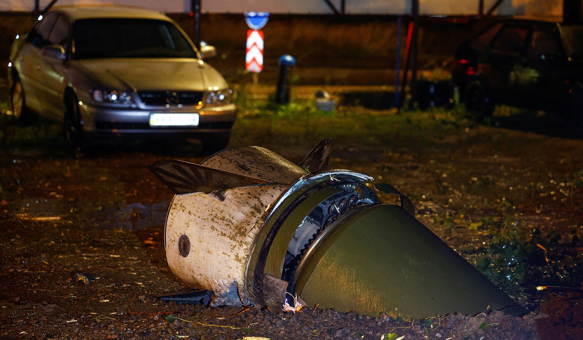 Part of a Russian ballistic missile that got stuck in the ground after a strike in Kyiv