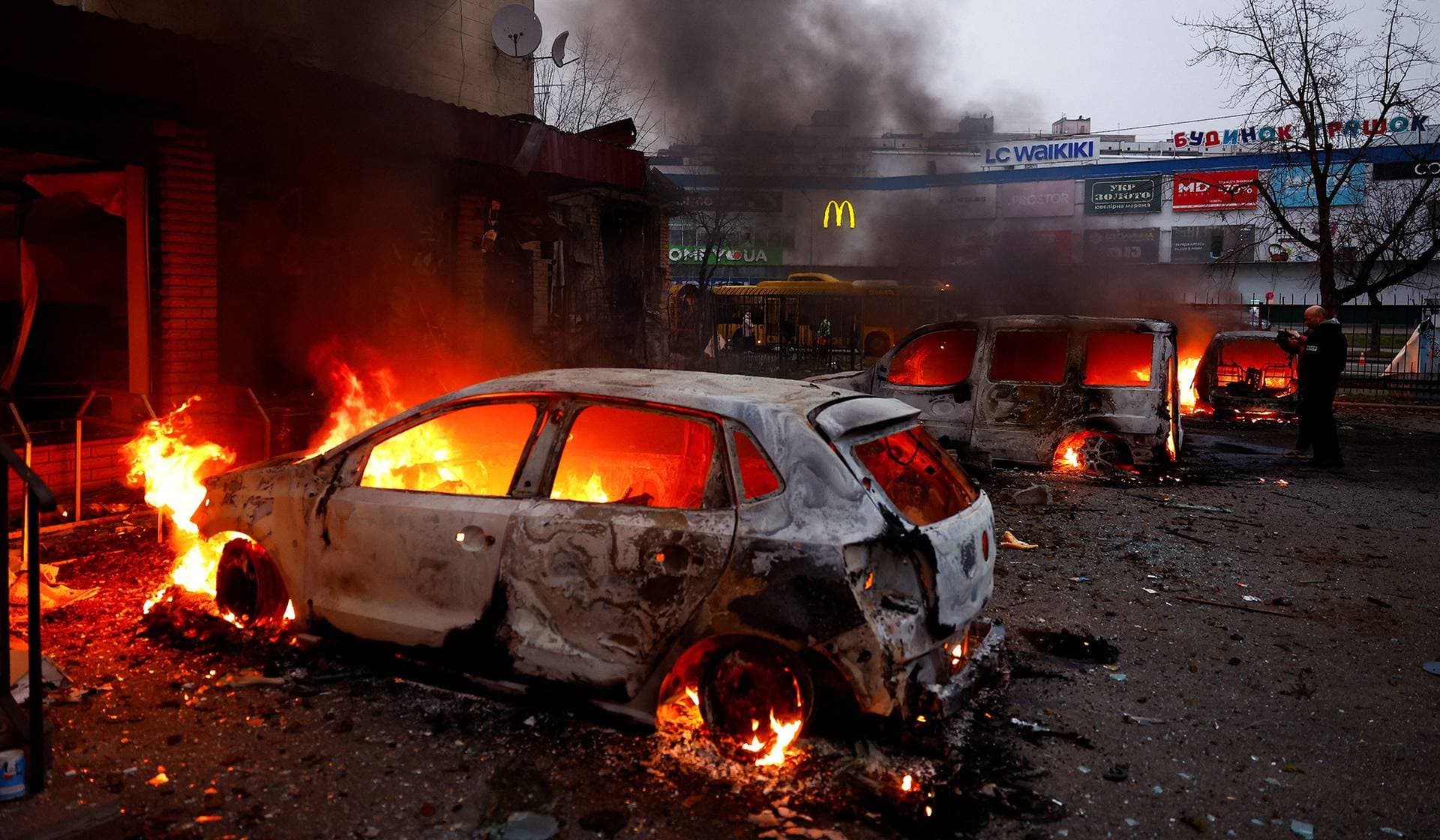 Vehicles burn after being damaged during a Russian missile and drone attack on Kyiv