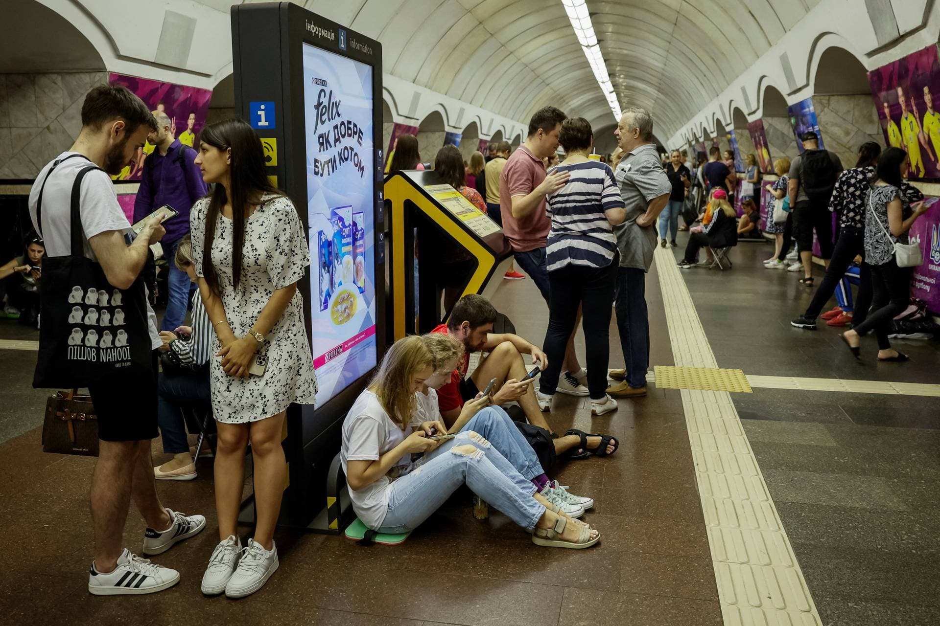 People take cover inside a subway station during an air raid alert, amid Russia's attack on Ukraine, in Kyiv