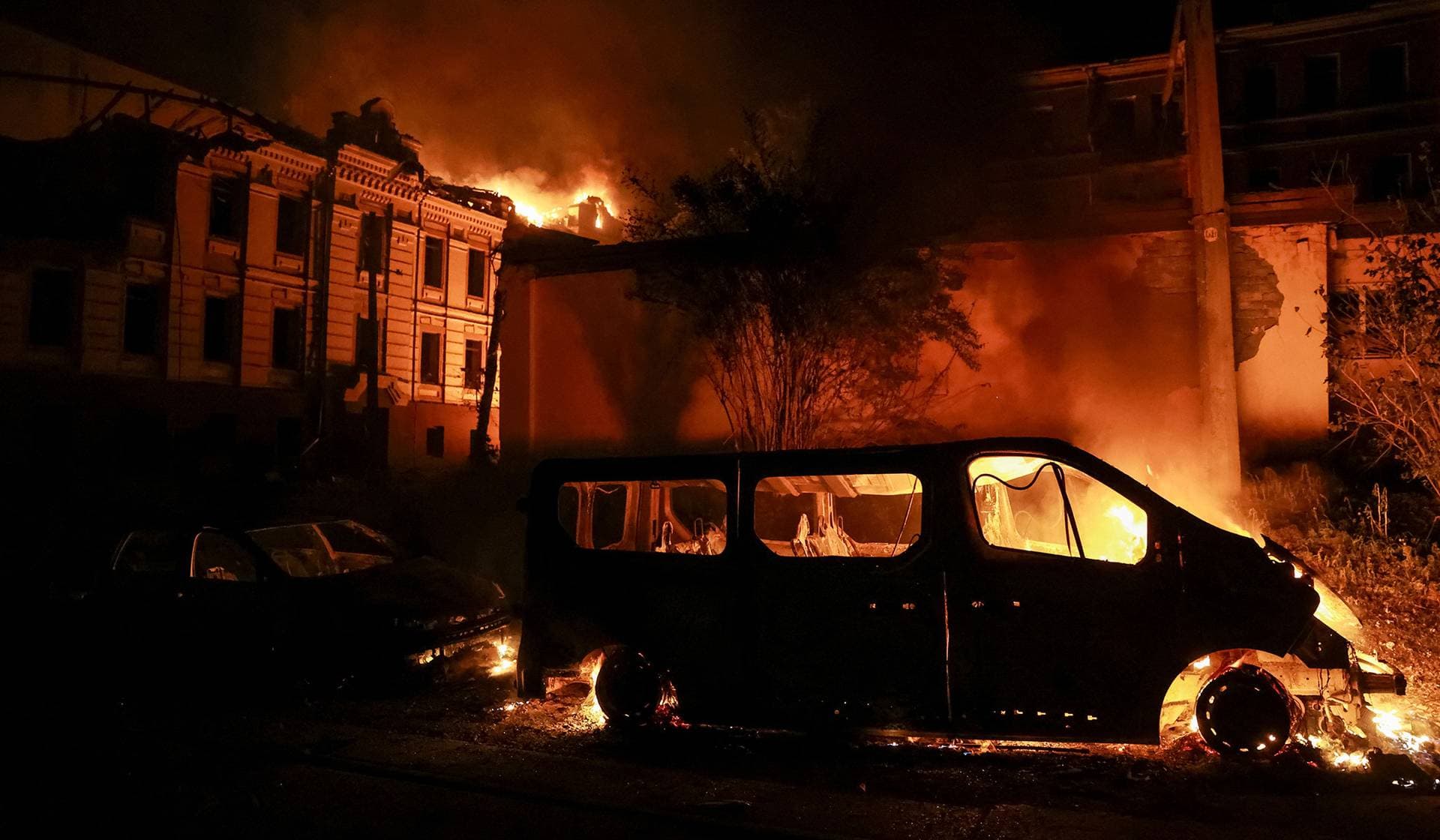 Smoke and fire rise at the site of a Russian missile strike in Kyiv