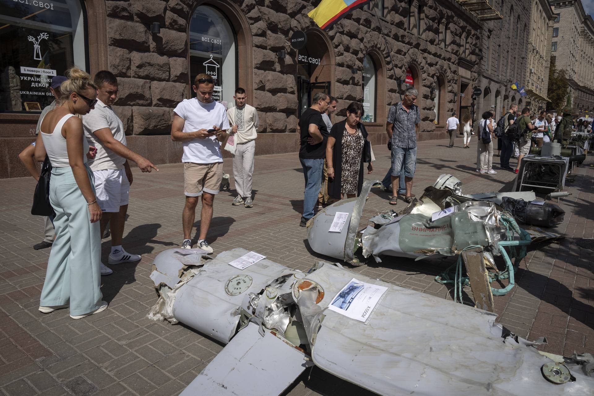 People look at fragments of Russian rockets which have been on display on the central Khreshchatyk boulevard in Kyiv
