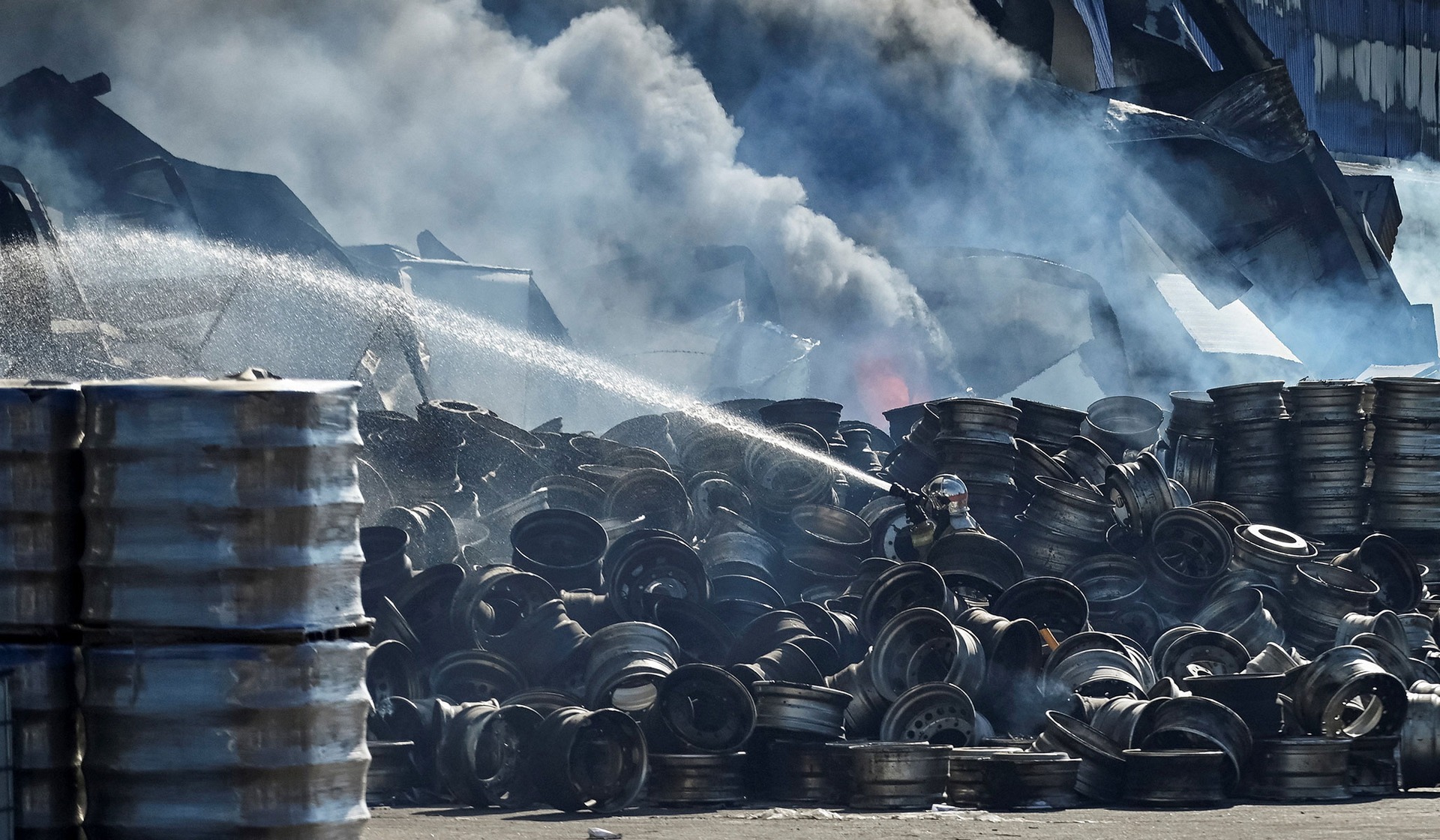 A firefighter works at a site of a Russian drone strike in Kyiv