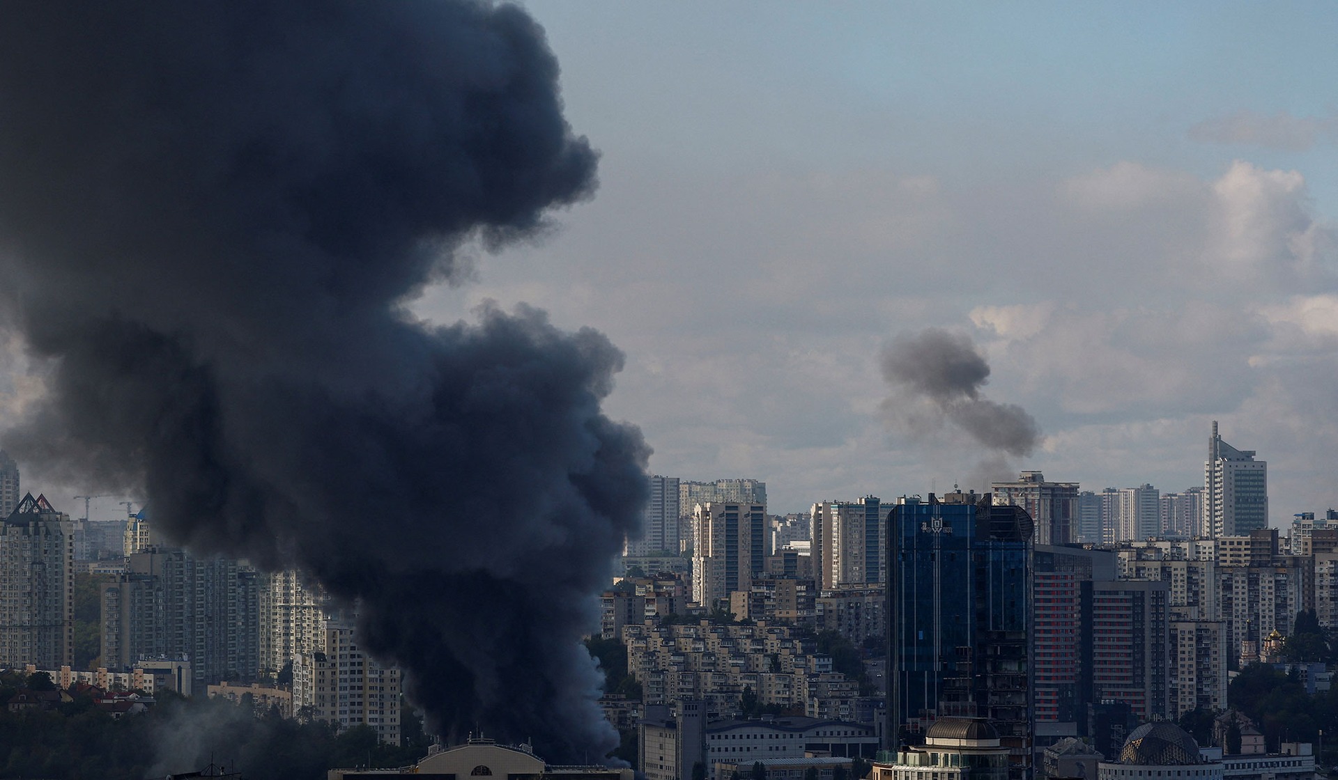 Smoke rises over the city after Russian drone strikes in Kyiv, Ukraine, September 23, 2026.