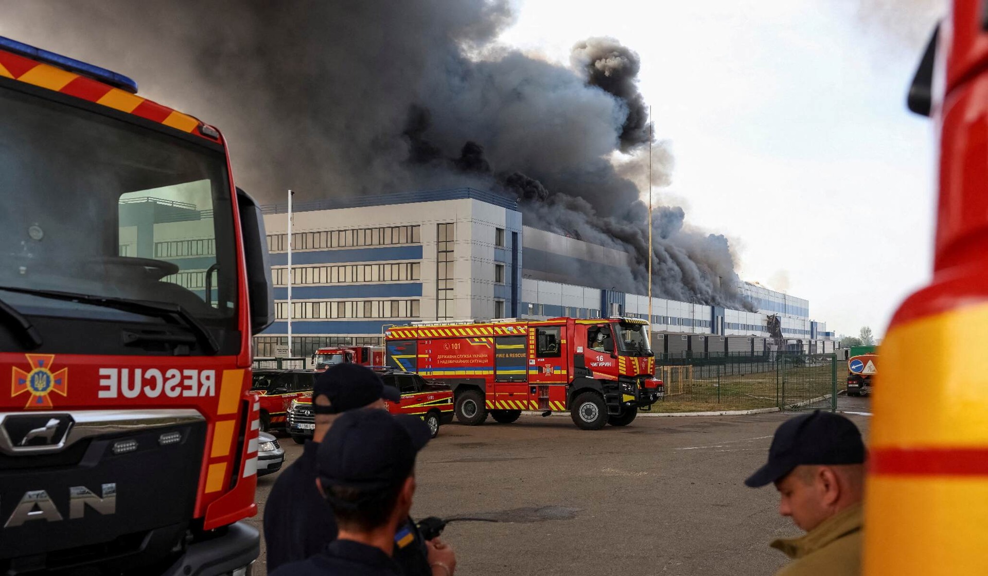 Firefighters work at the site of a Russian drone strike in the Kyiv region