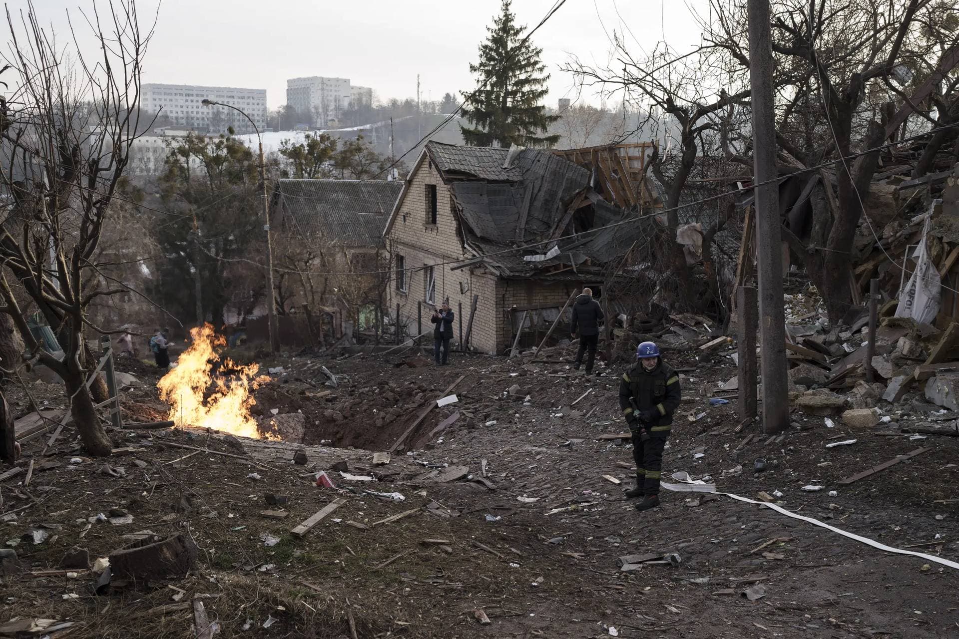 Emergency workers arrive at a residential area hit during a Russian attack in Kyiv
