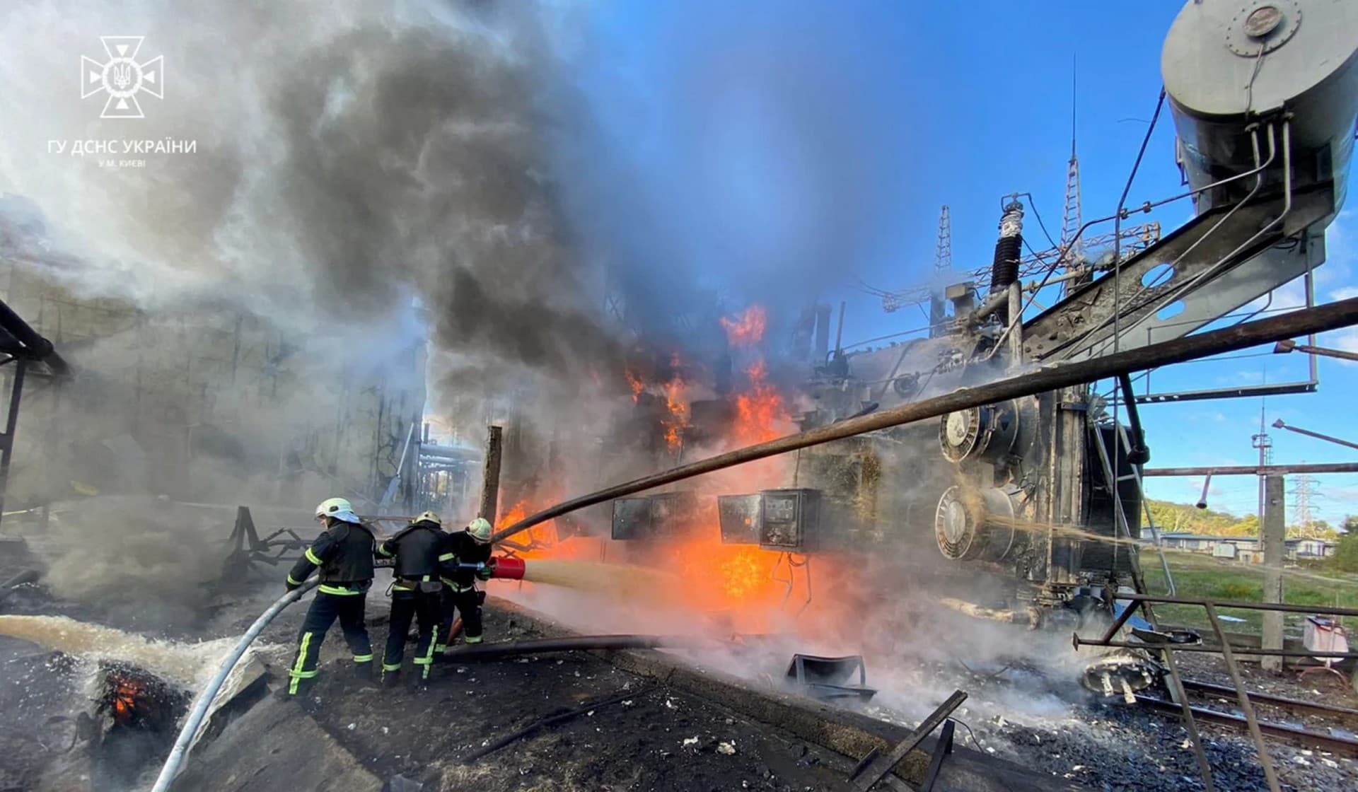 Firefighters work at a site of infrastructure damaged by a Russian missile strike in Kyiv