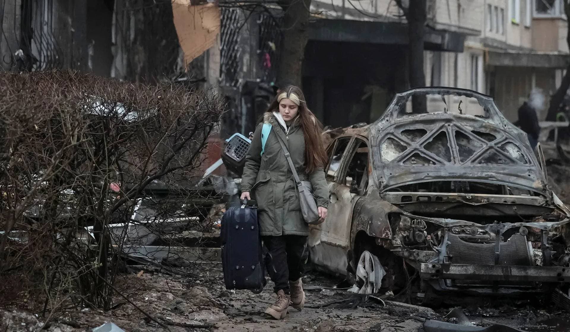 Local residents leave their apartment building damaged during a Russian missile strike in Kyiv