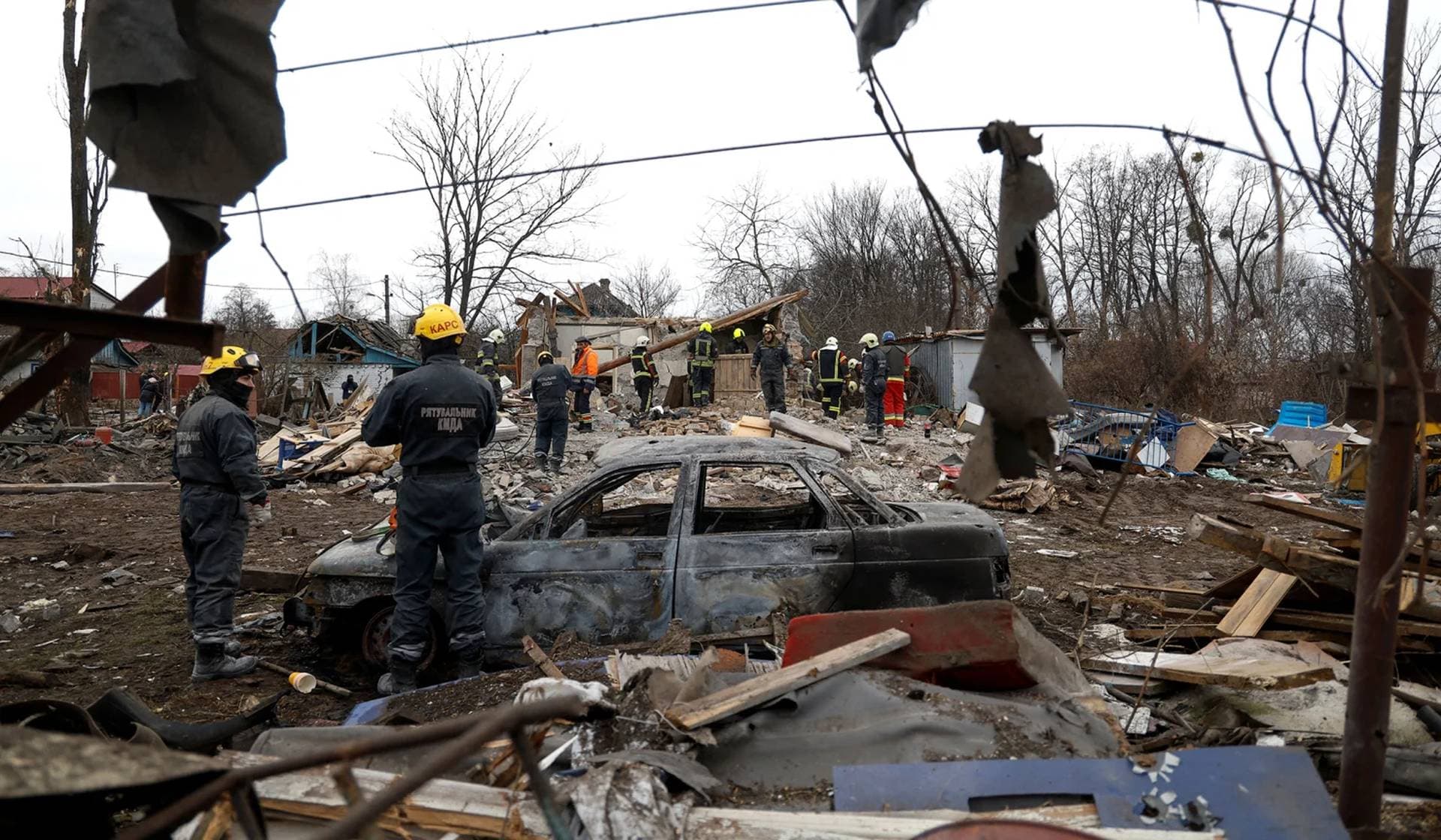 Rescuers work at a site of a residential house damaged during a Russian missile strike in Kyiv