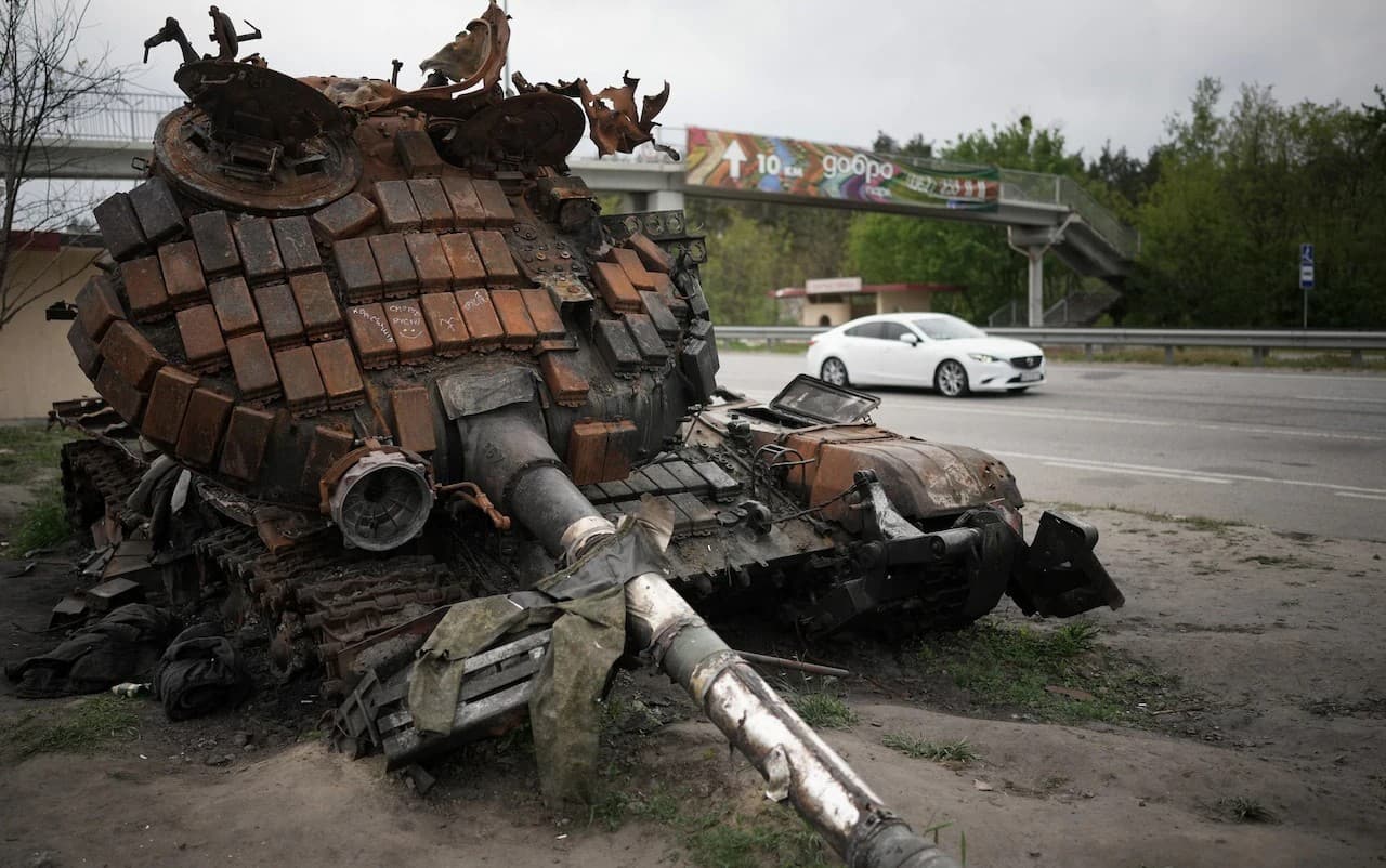 A rusting Russian battle tank rests beside a Kyiv motorway last week