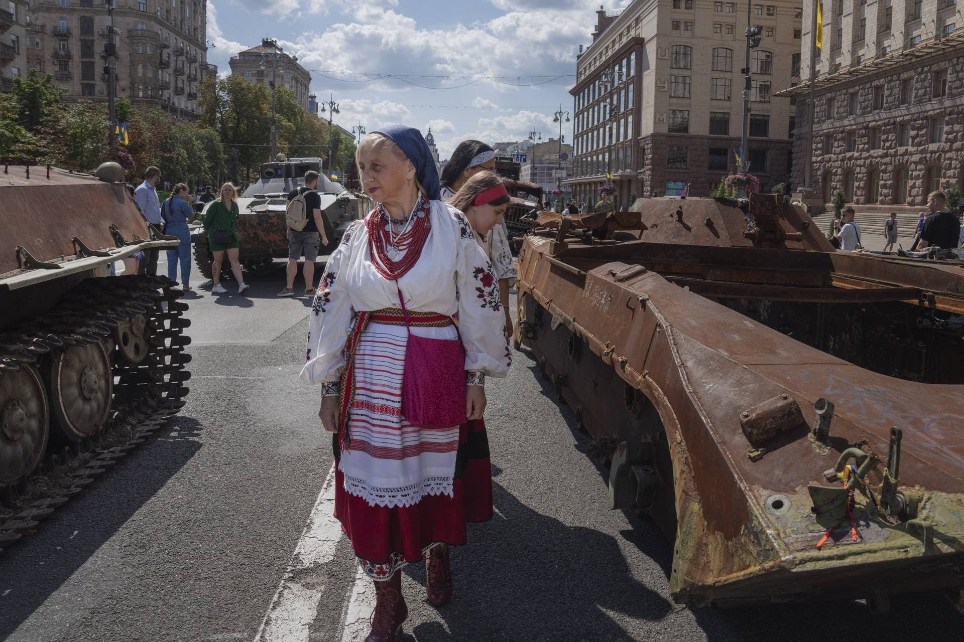 People look at a large number of burned out and captured Russian tanks and infantry carriers which are displayed on the central Khreshchatyk boulevard in Kyiv