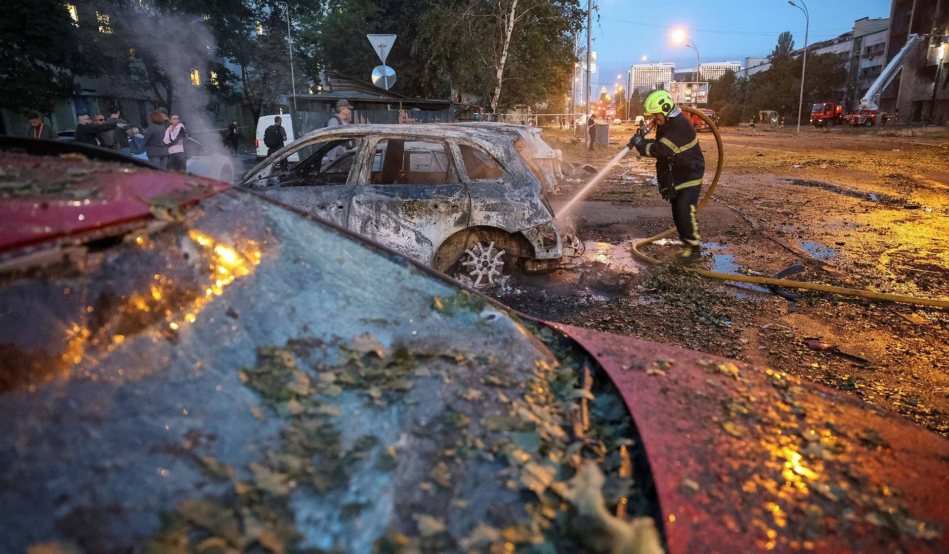 A firefighter works at a site of a Russian missile strike in Kyiv Region