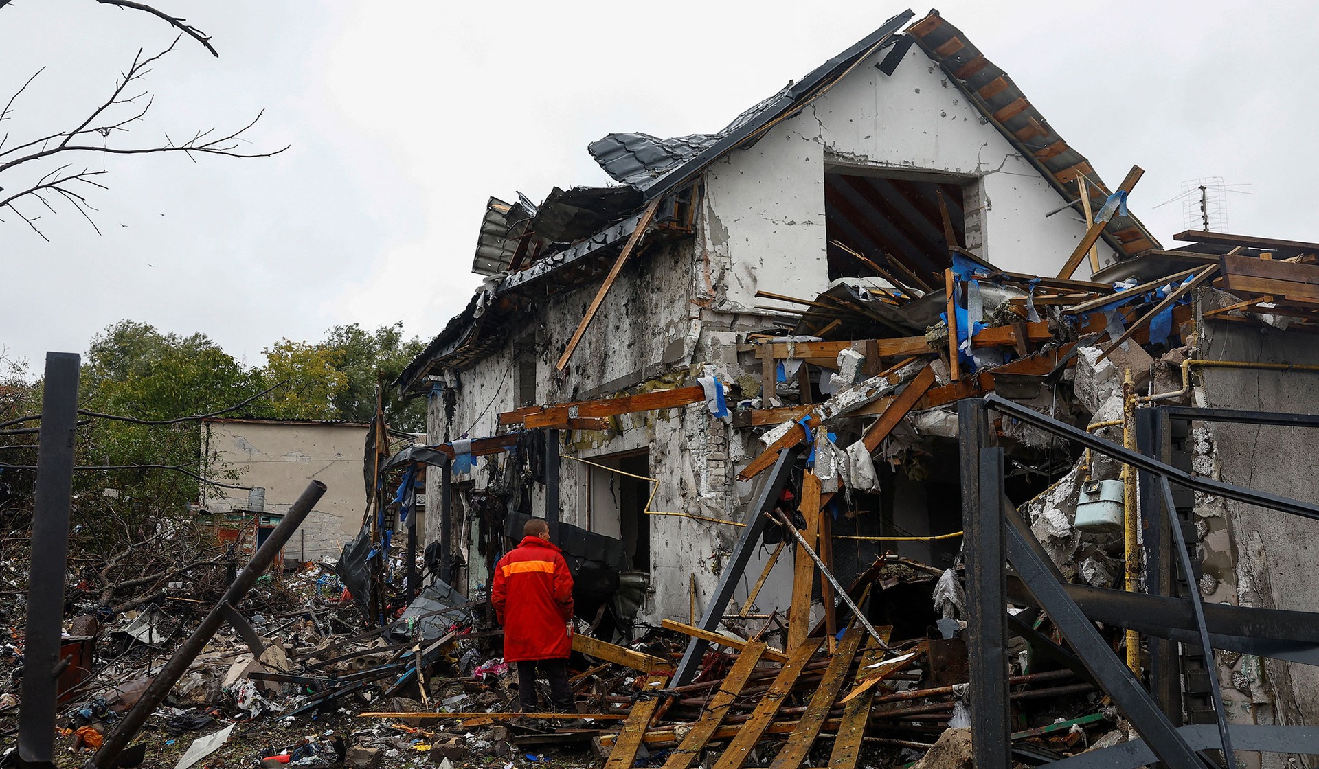 Stanislav looks at his house damaged during an overnight Russian missile strike in Kyiv