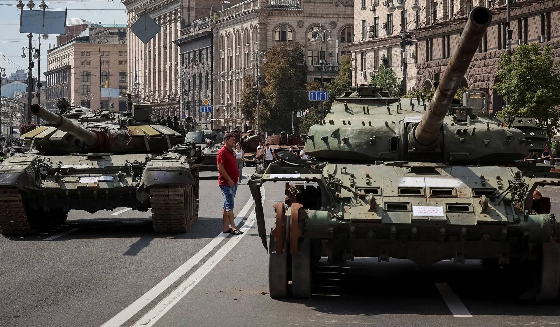 People attend an exhibition displaying destroyed Russian military vehicles in central Kyiv