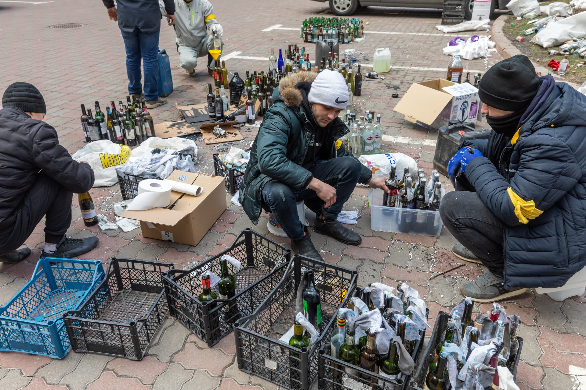 Members of Kyiv territorial defense making Molotov cocktails