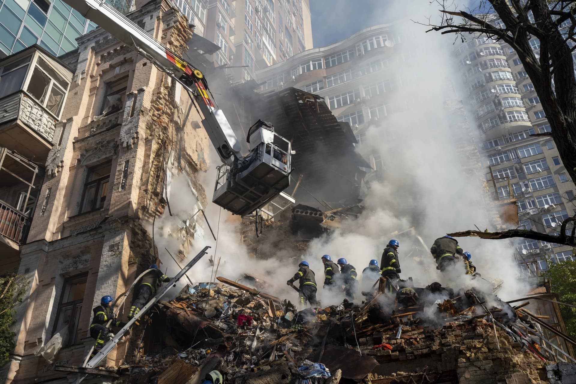 Firefighters work after a drone attack on buildings in Kyiv