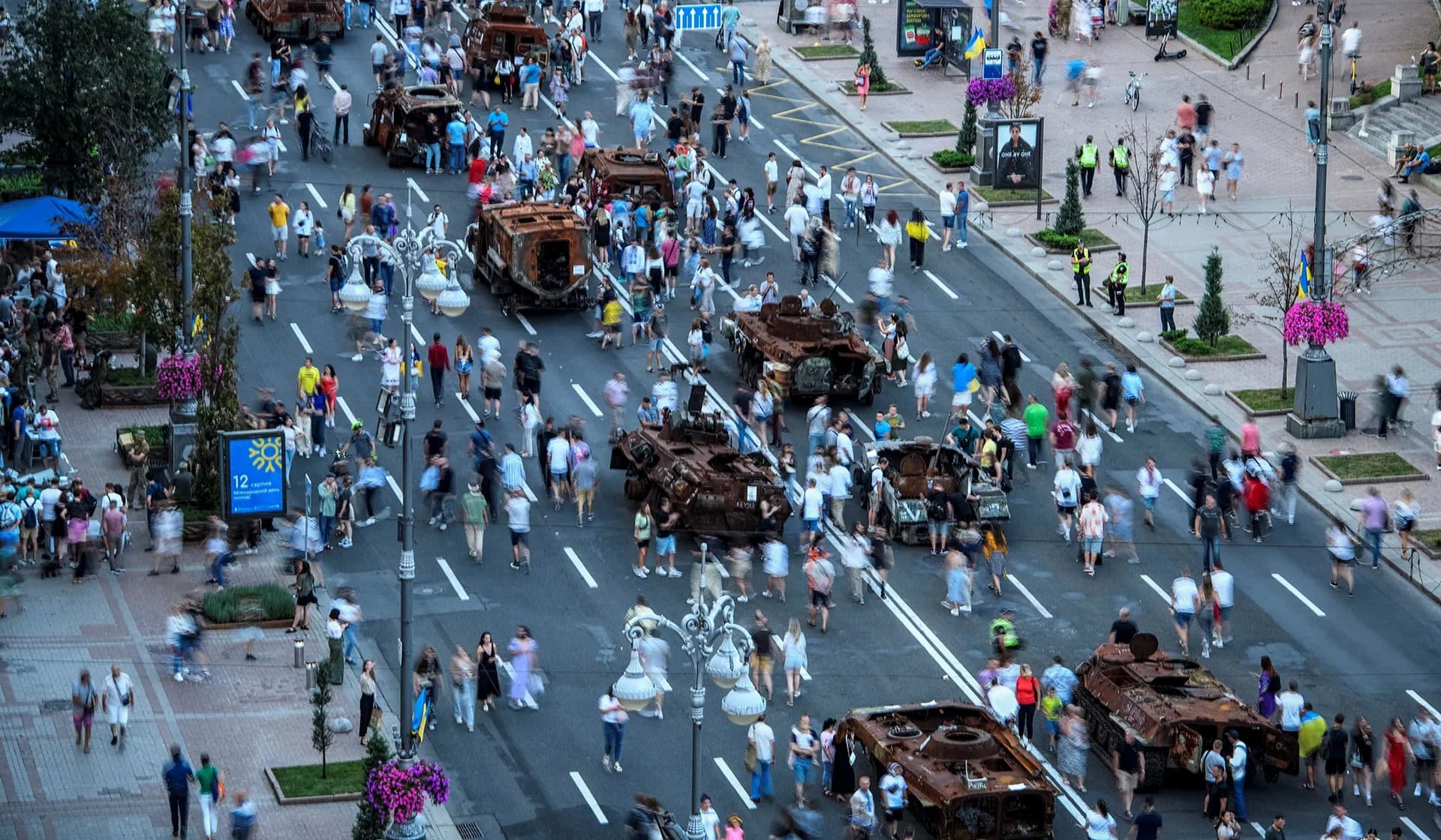 People attend an exhibition displaying destroyed Russian military vehicles on the main street Khreshchatyk as part of the celebration of the Independence Day of Ukraine in central Kyiv