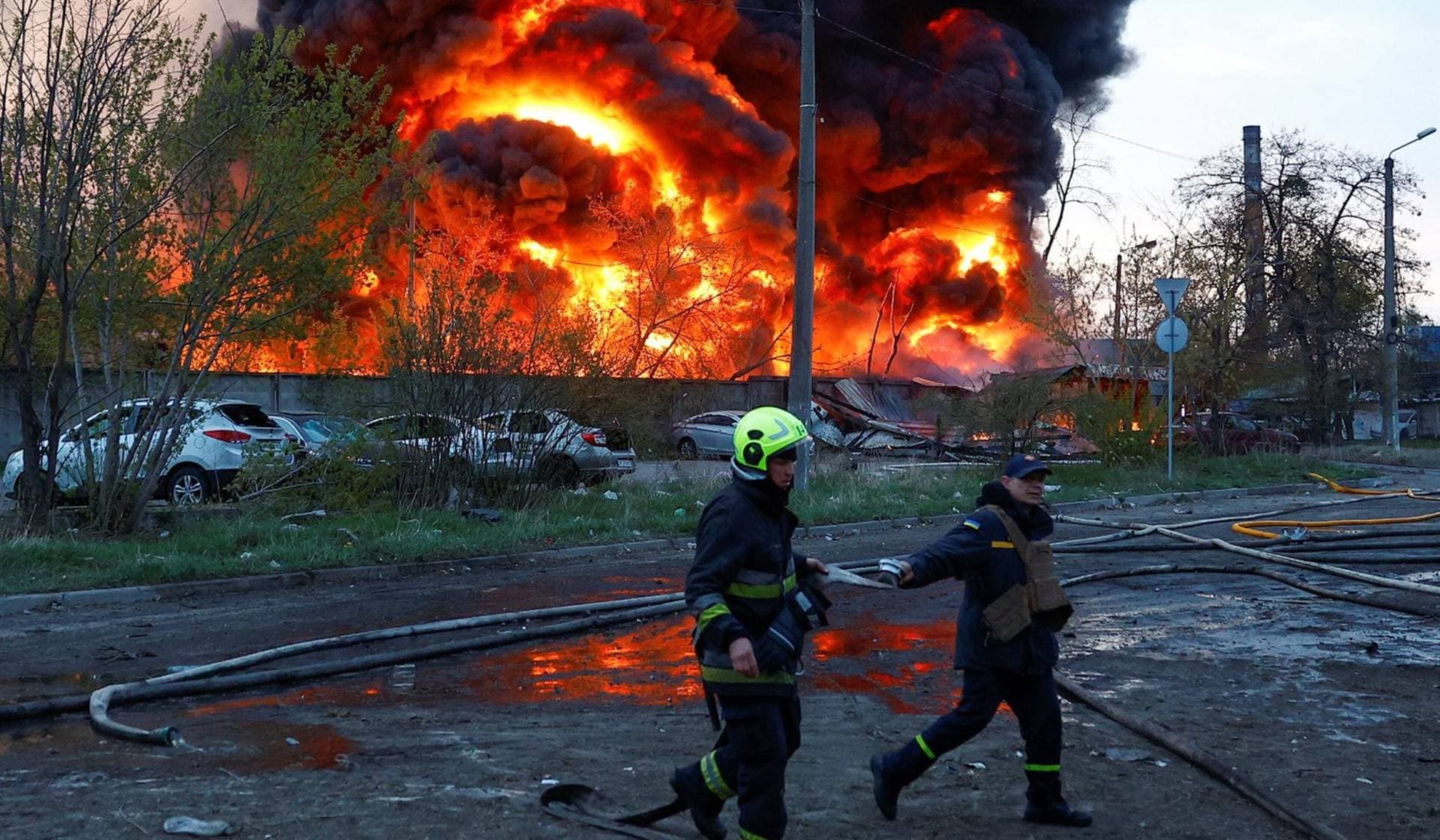 Firefighters work at the site of a recyclable materials warehouse hit by a Russian missile strike in Kyiv