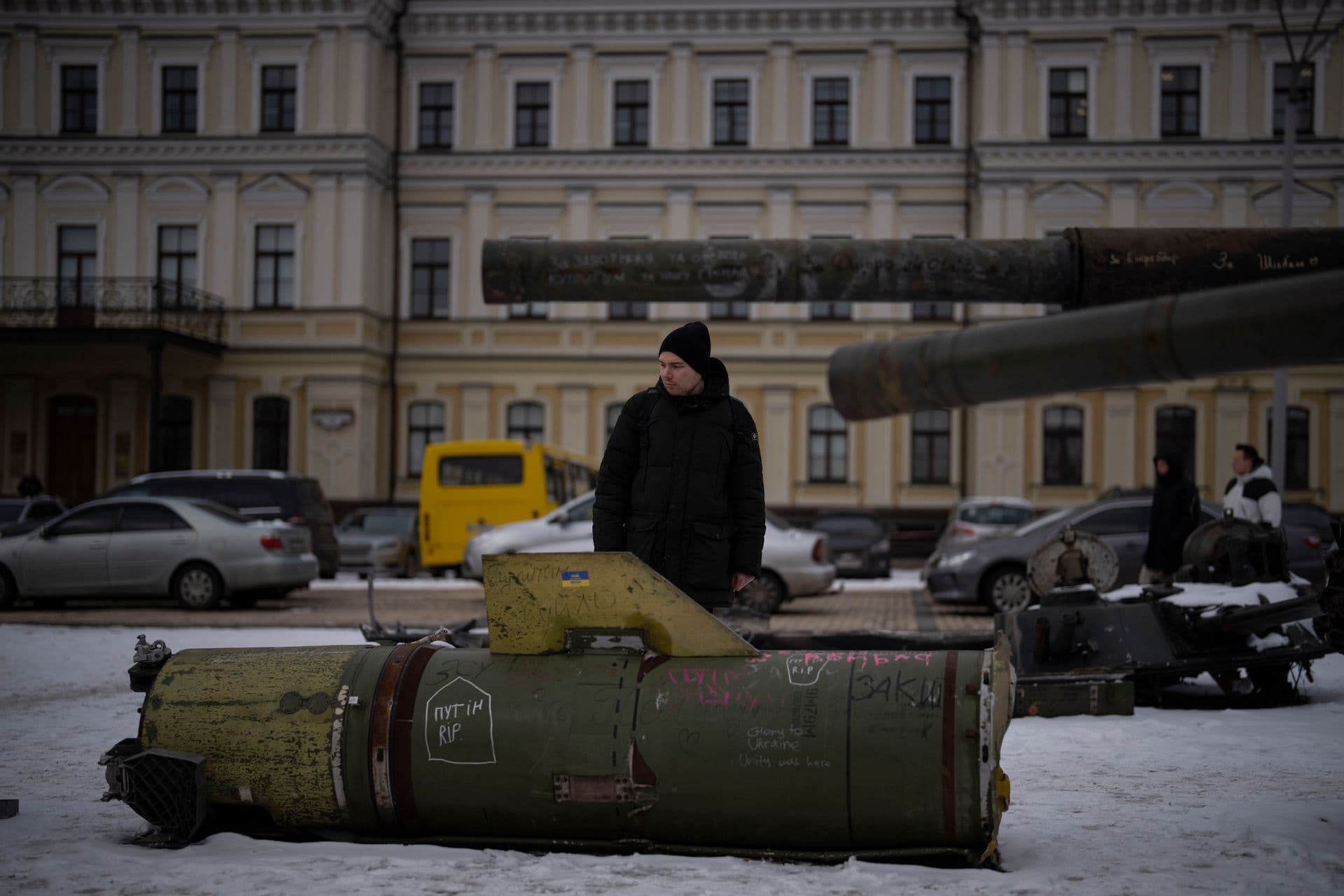 A man looks at the remains of a Russian missile displayed in central Kyiv