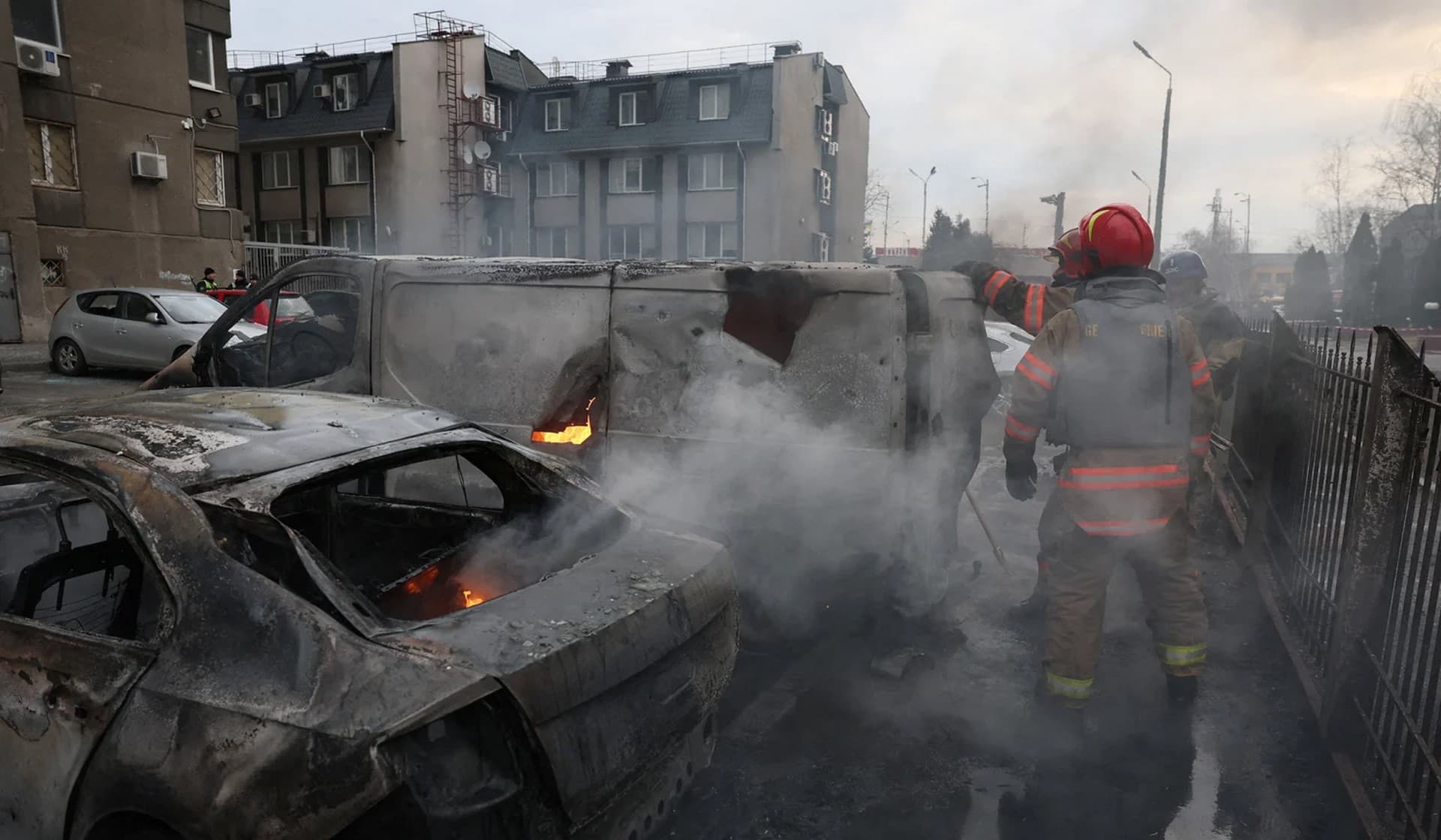 Emergency workers at the site of a Russian missile strike in Kyiv