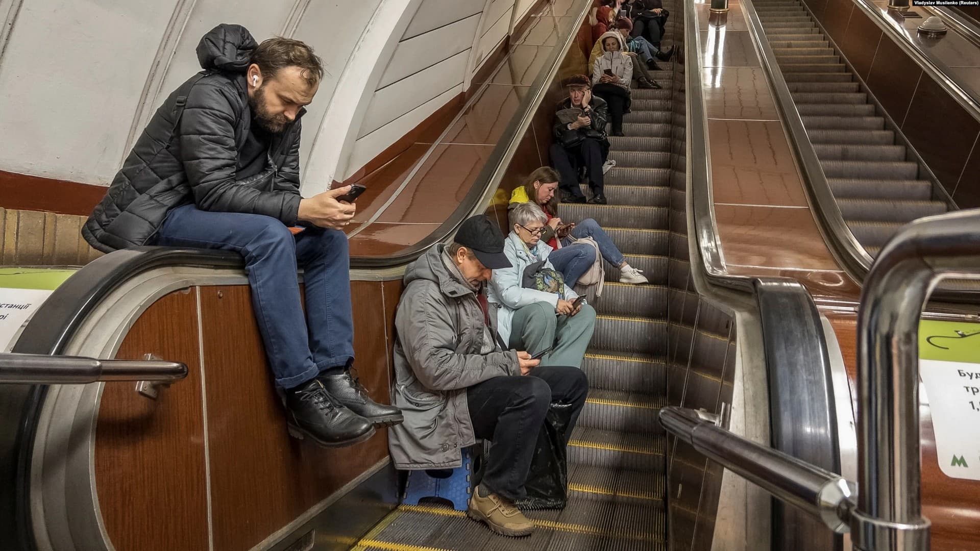 People shelter inside a subway station during a Russian missile attack in Kyiv