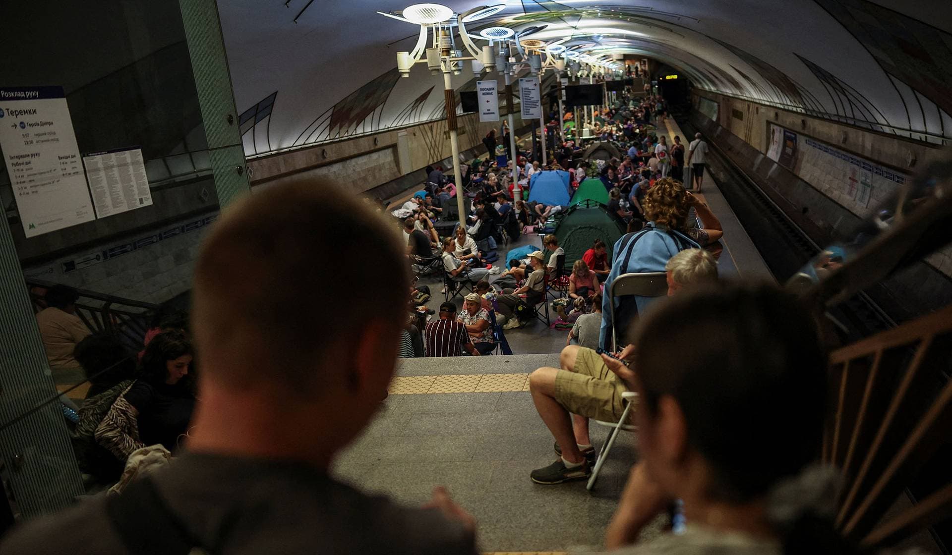 People take shelter inside a metro station during an overnight Russian missile and drone strike in Kyiv