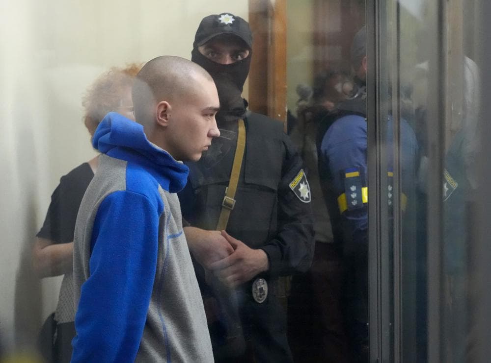 Russian army Sergeant Vadim Shishimarin is seen behind a glass during a court hearing in Kyiv