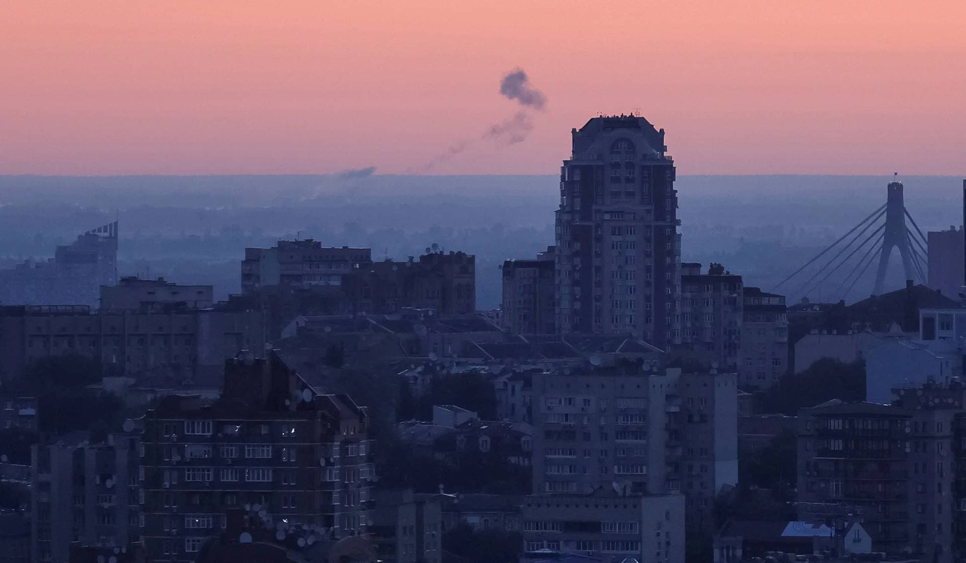 Smoke rises in the sky over the city after a Russian drone strike in Kyiv