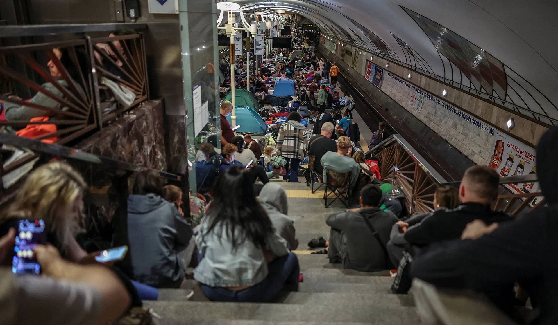 People take shelter inside an overcrowded metro station during a Russian missile and drone strike in Kyiv, Ukraine, July 30, 2026.