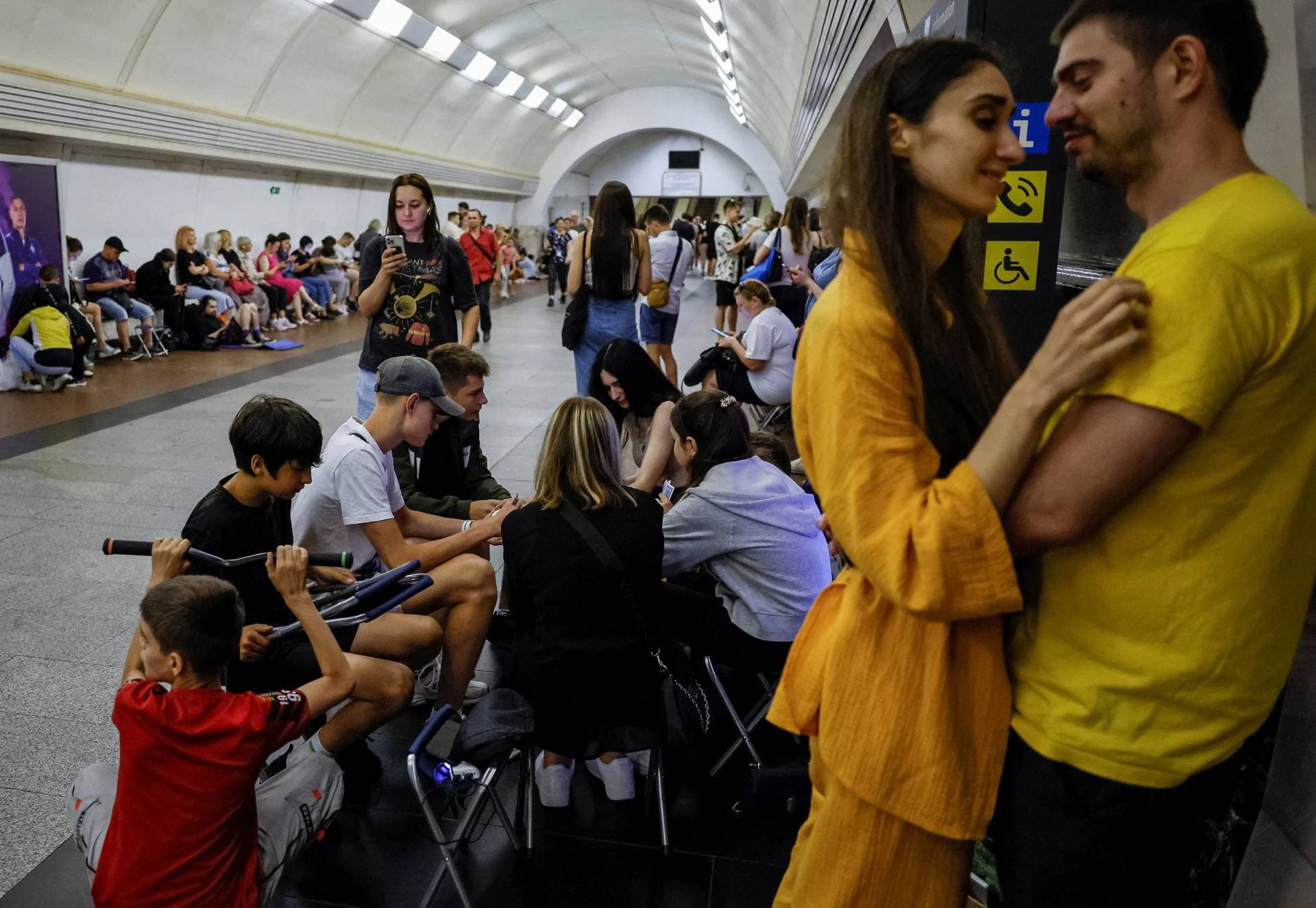 People take cover inside a subway station during an air raid alert in Kyiv on Wednesday.