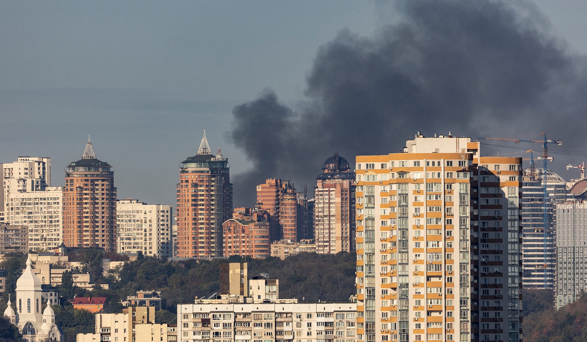 Smoke rises in the city following a Russian drone strike in Kyiv