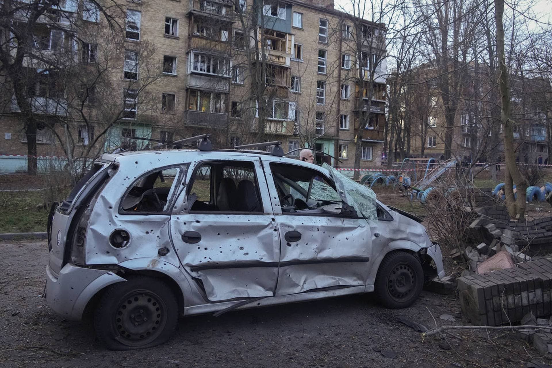 A damaged car is seen at the scene of Russian shelling in Kyiv