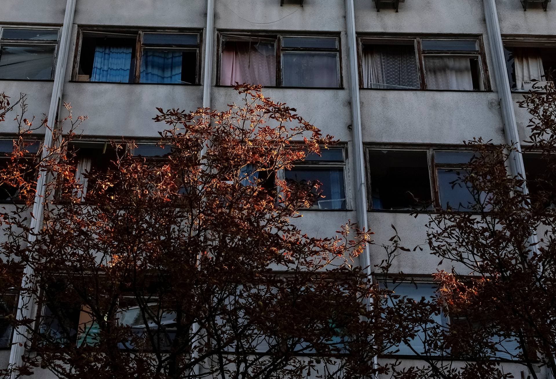 Broken windows are seen in a building damaged during a Russian drone strike in Kyiv