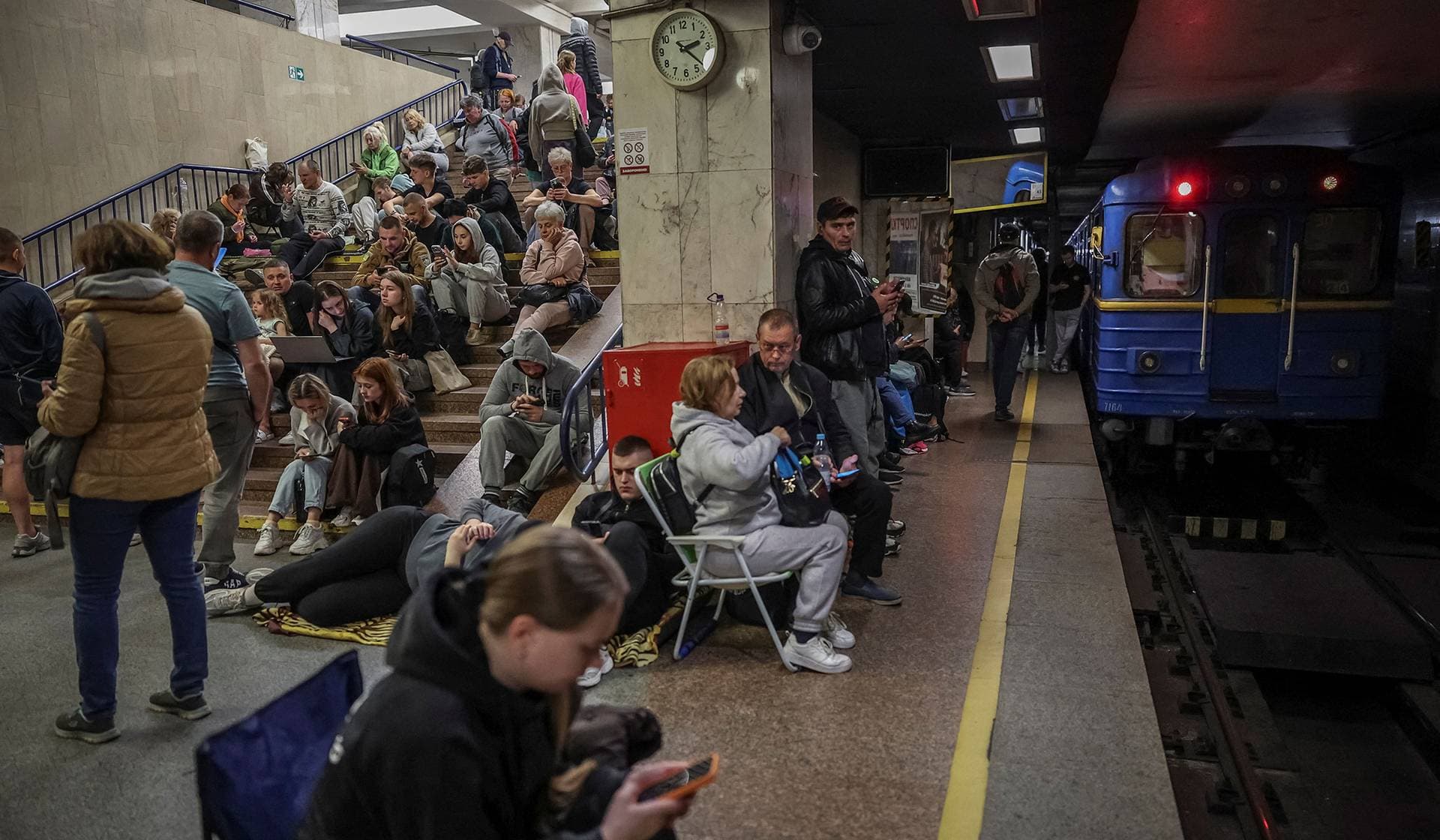 Residents take shelter inside a metro station during a Russian missile and drone strike in Kyiv