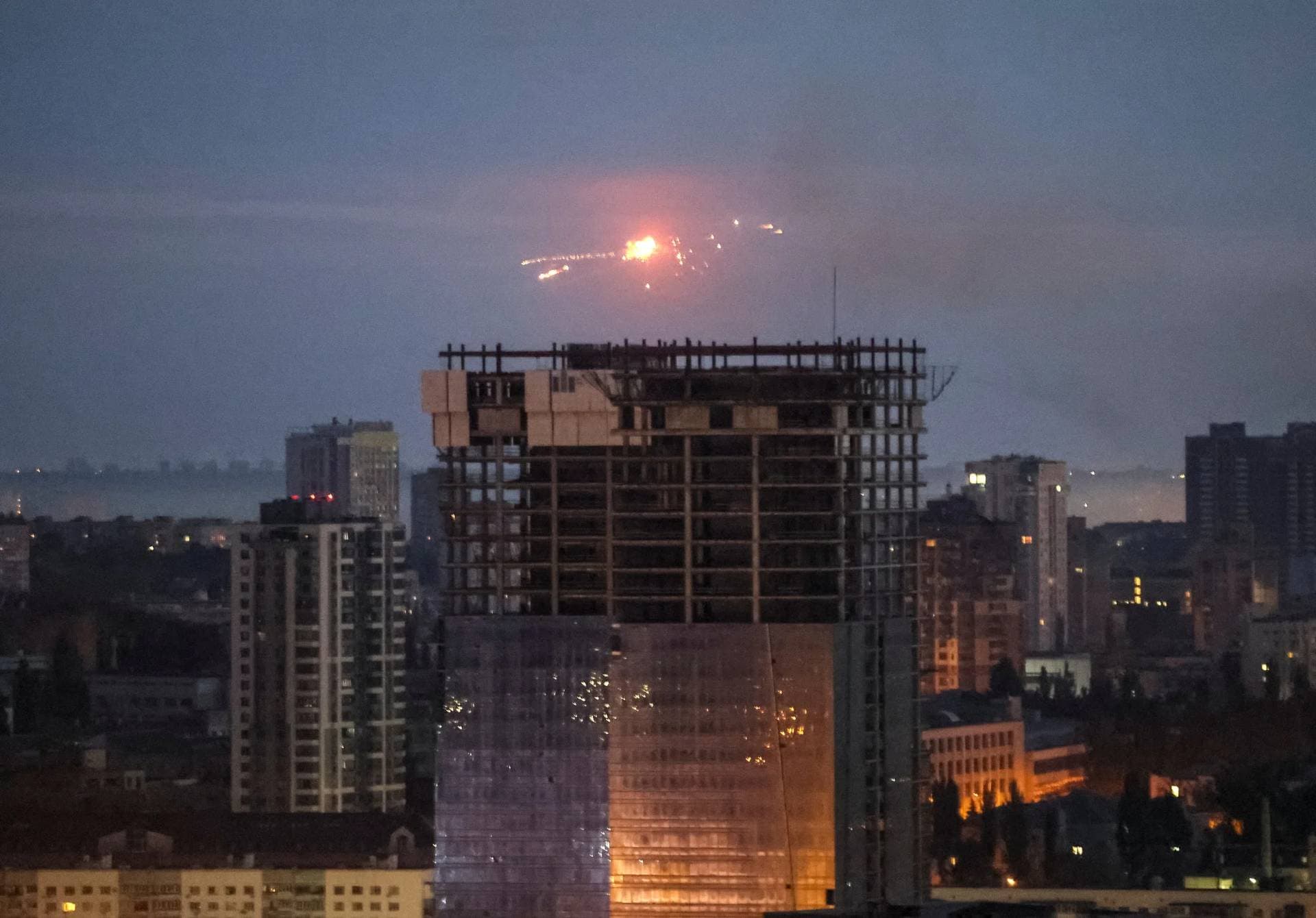 Loud explosions were seen in the sky over Kyiv as dawn was breaking
