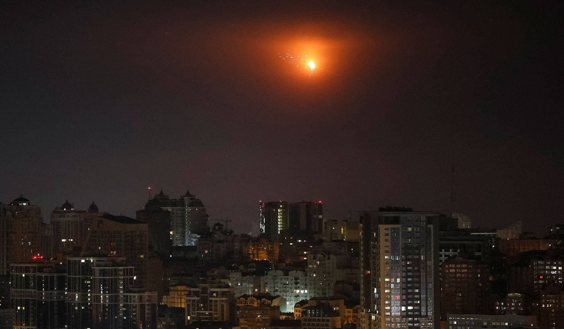 An explosion of a Russian drone in the sky over the city during a Russian missile and drone strike in Kyiv