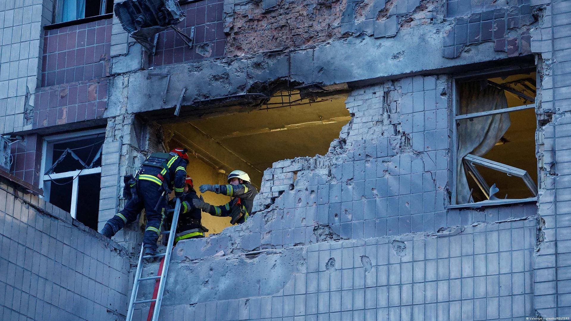 Rescuers work at the site of a building damaged during a Russian suicide drone strike in Kyiv