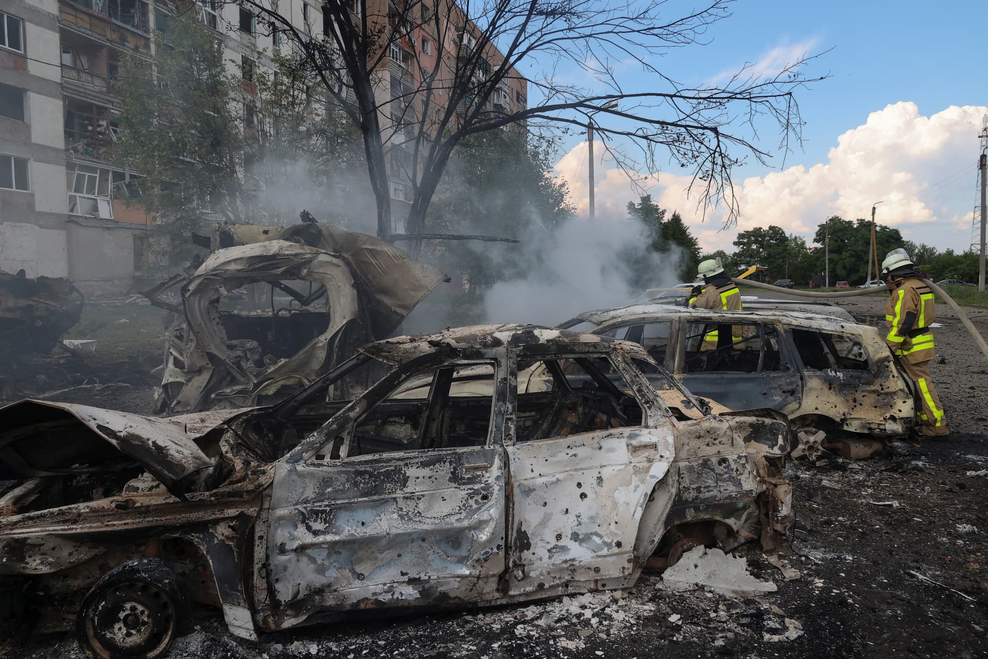 Burned-out cars at the site of a Russian military strike in the town of Pervomaiskyi