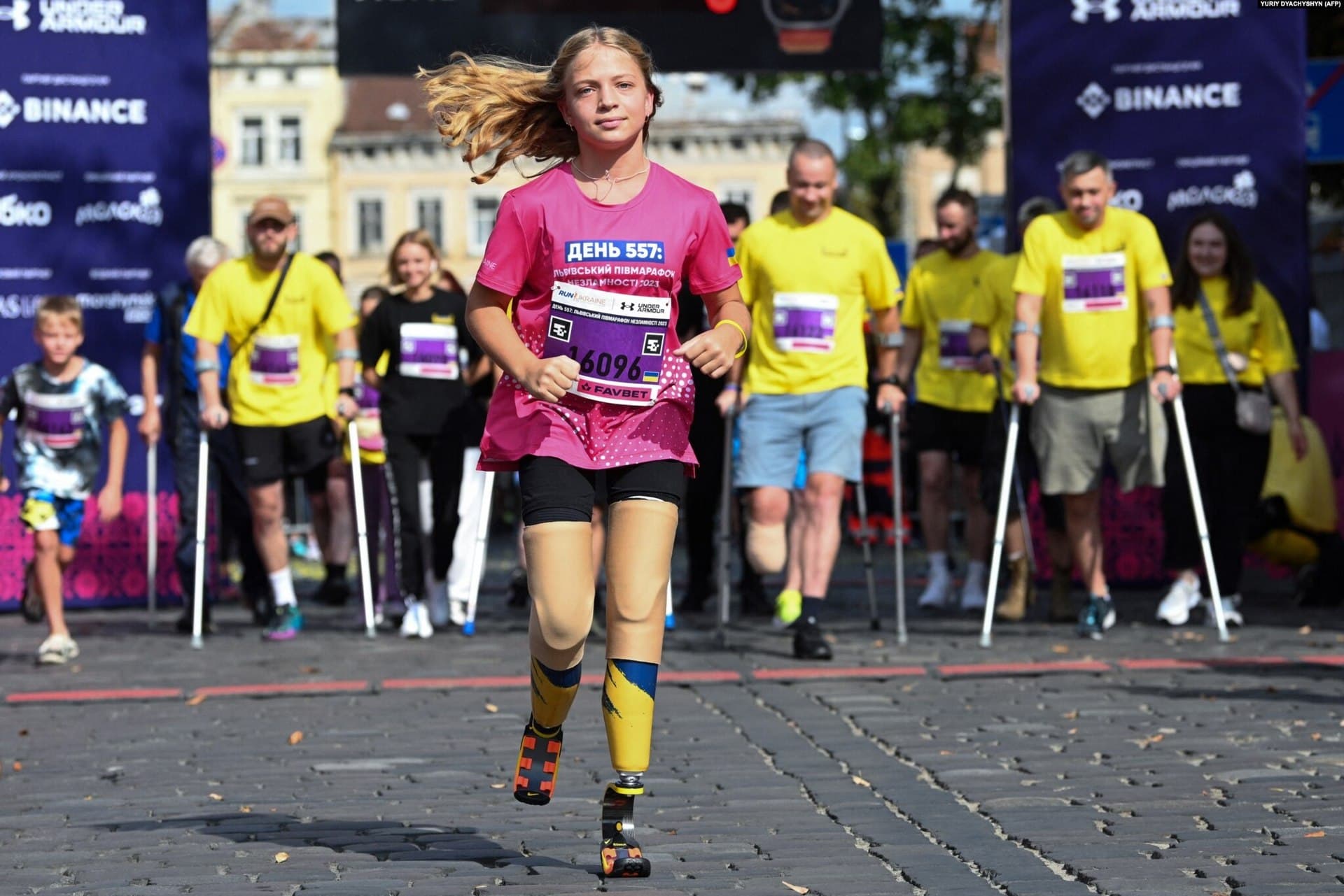 Yana Stepanenko, a 12-year-old who lost both legs during a missile attack at the Kramatorsk railway station, takes the lead