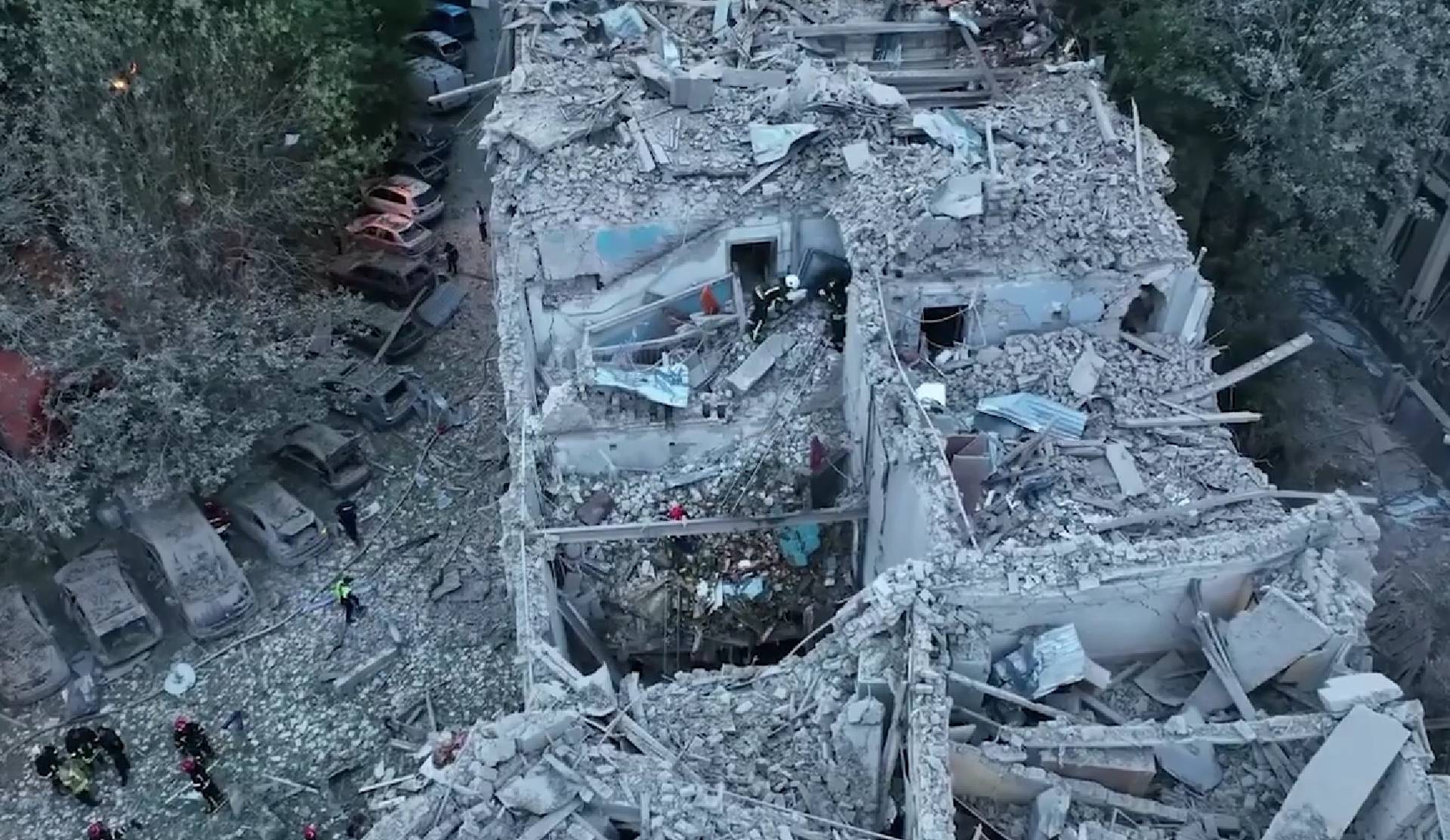 Rescue workers respond to a Russian missile strike that hit an apartment building in Lviv