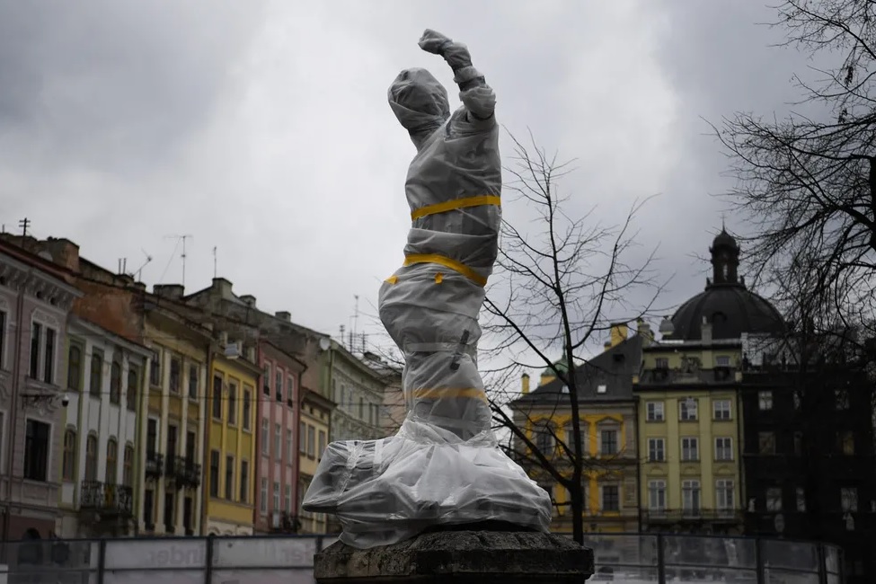 Statues in Lviv are wrapped with fireproof material to protect them from fire and accidental fragments