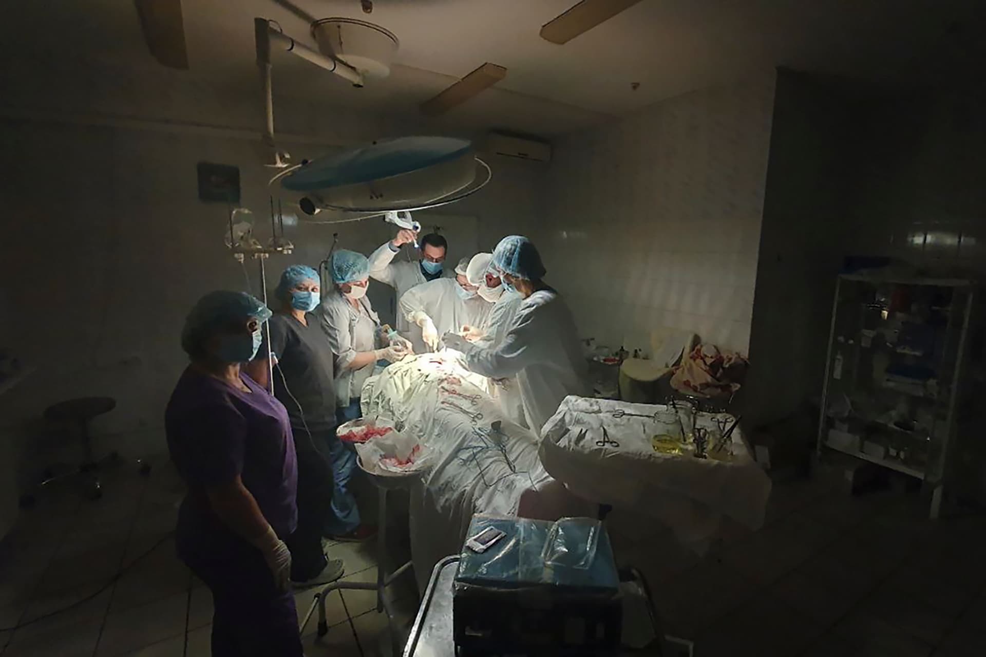 Ukrainian doctor performing complicated, dangerous surgery at the hospital in Lviv