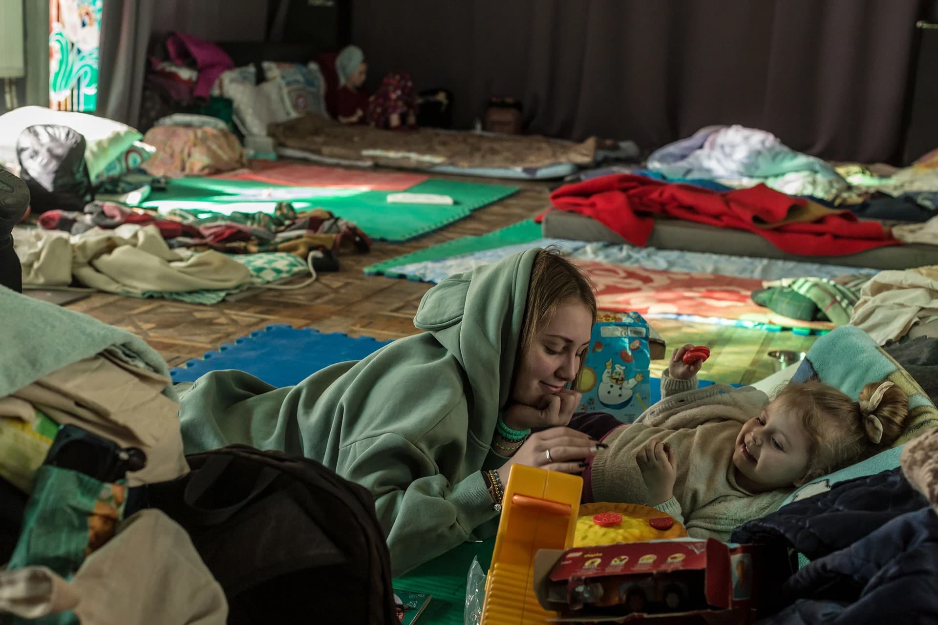Kateryna plays with Dominika at a temporary shelter  at the Lviv Regional Academic Puppet Theater