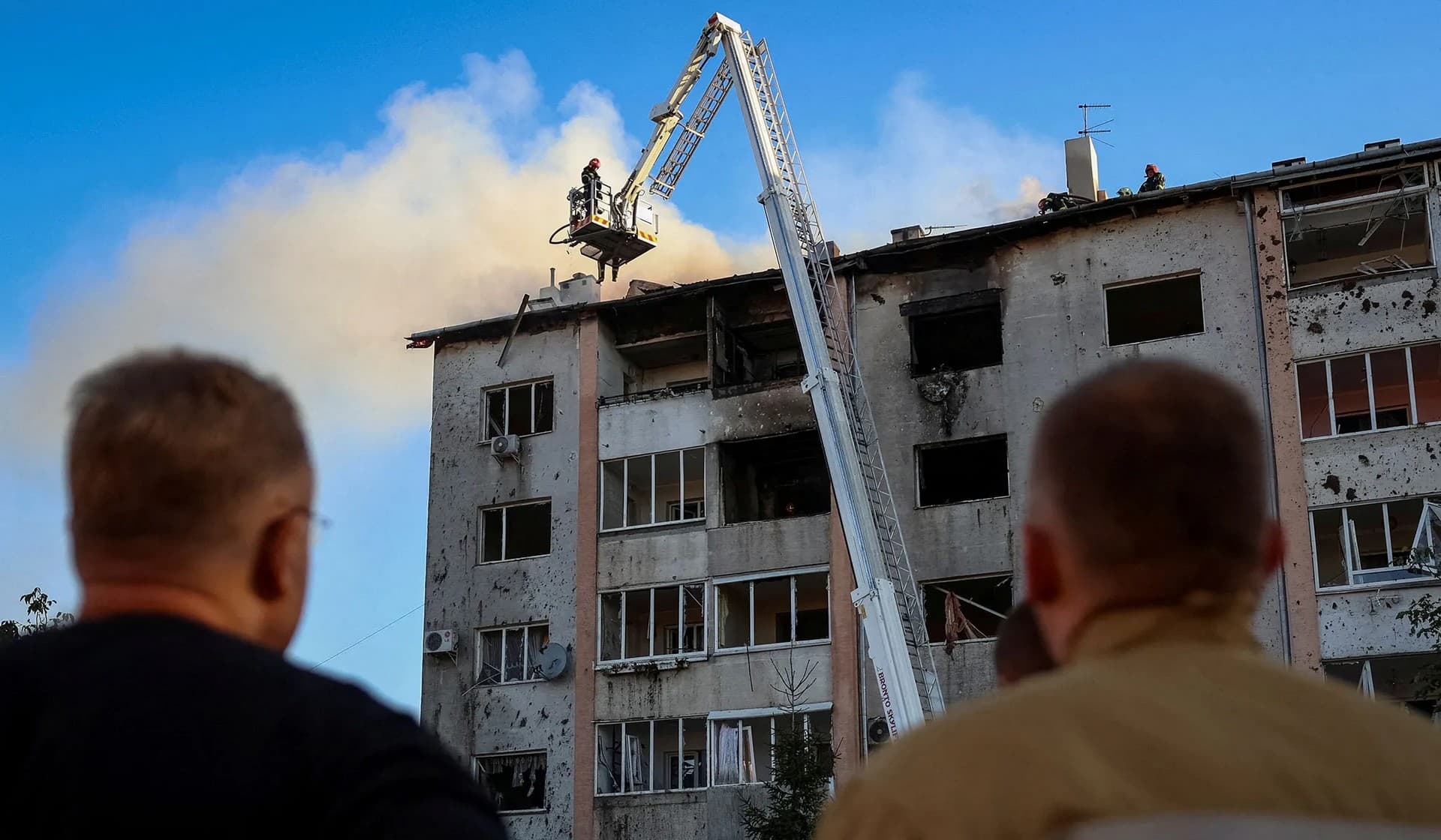 Rescuers work at a site of a residential building destroyed during a Russian military strike in Lviv